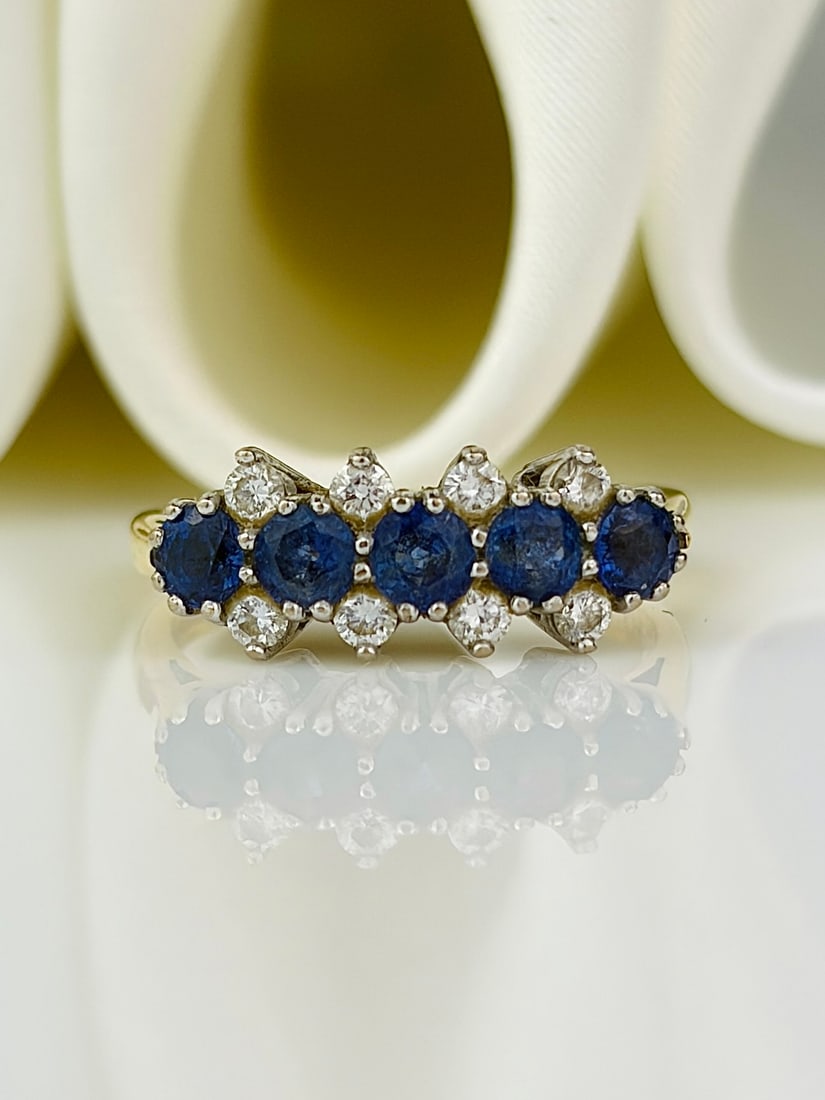 pretty vintage 18ct yellow gold sapphire and diamond unusual design ring: pretty vintage 18ct yellow gold sapphire and diamond unusual design ring Beautiful bright blue sapphires! Weight: 3.05g Size: UK J1/2, US 5.5, Width 6mm, height off finger 4mm Materials: