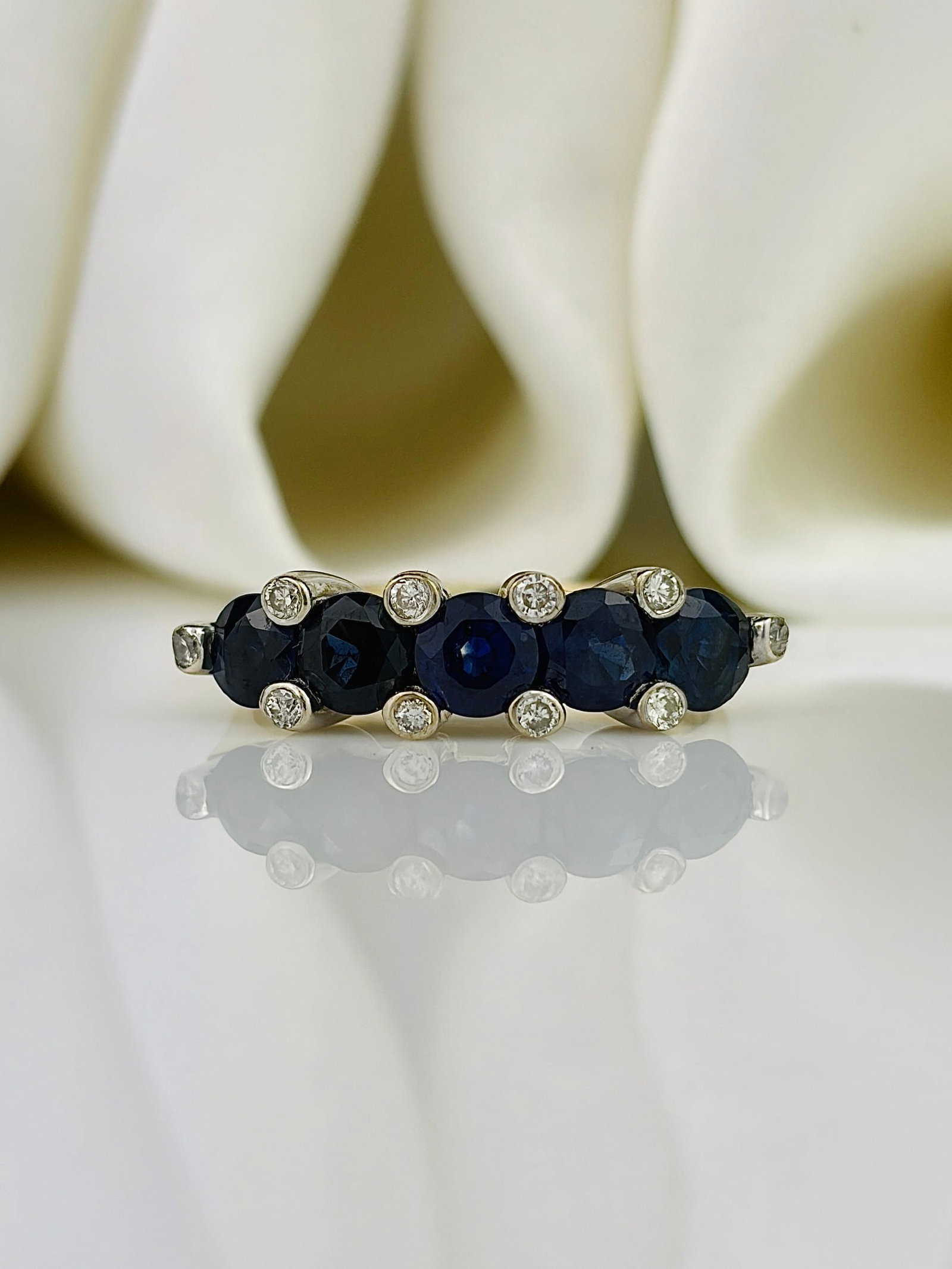 Vintage Sapphire and Diamond 9ct Gold Five-Stone Ring: Vintage Sapphire and Diamond 9ct Gold Five-Stone Ring Weight: 3.31g Size: UK L, US 6, Width 6mm, Height off finger 5mm Materials: 9ct Gold Hallmarks: London 1989, 9ct Condition: The