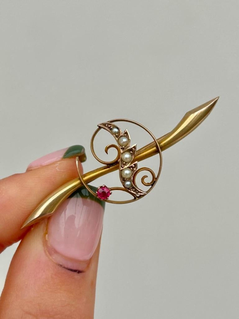 Yellow Gold Pearl and Red Stone Bar Brooch: Pearl and red stone brooch sweetest brooch measurements length 47mm width 16mm weight 2.33g hallmarked 9ct condition: see photos office use: /