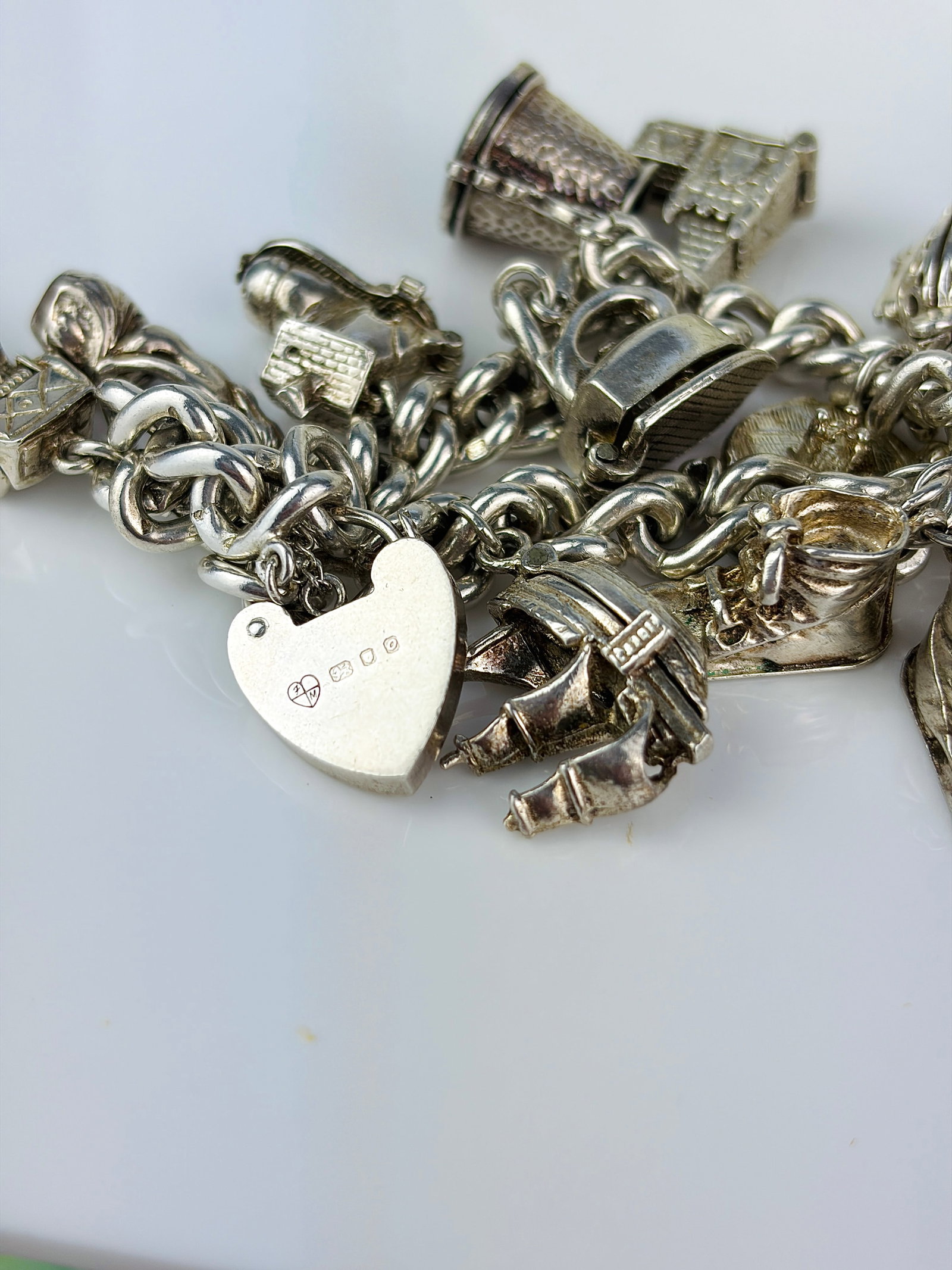 HEAVY STERLING SILVER OPENING CHARMS - FULL BRACELET - SOME RARE DESIGNS - 7