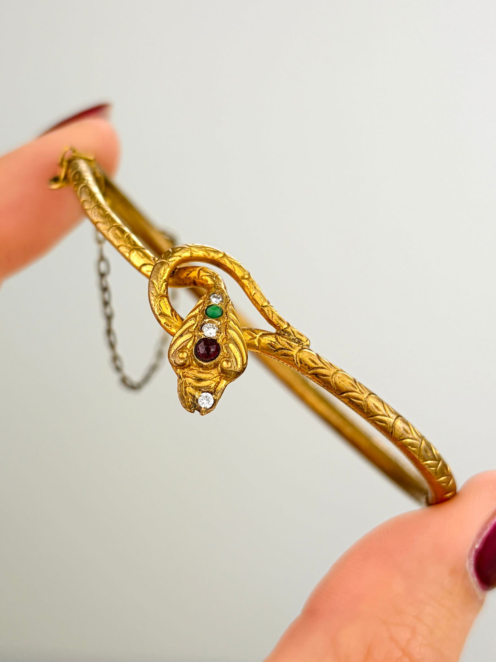 Diamond and Ruby Wrapped Snake Bangle: Diamond and Ruby Wrapped Snake Bangle not gold Weight: 12.54g Size: 17cm inner circumference, width of head 17.5mm Condition: The overall condition is very good Office Use: / The item will be sent