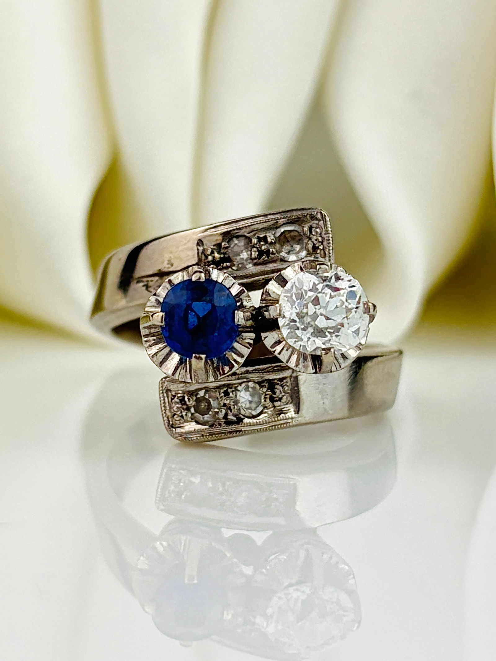 Chunky Sapphire and Diamond Moi et Toi Twist Ring in Platinum: Chunky Sapphire and Diamond Moi et Toi Twist Ring in Platinum Diamond approx .60pts. Such a unique design! Weight: 6.84g Size: UK M, US 6.5, Width 15mm, Height off finger 8.5mm Materials: