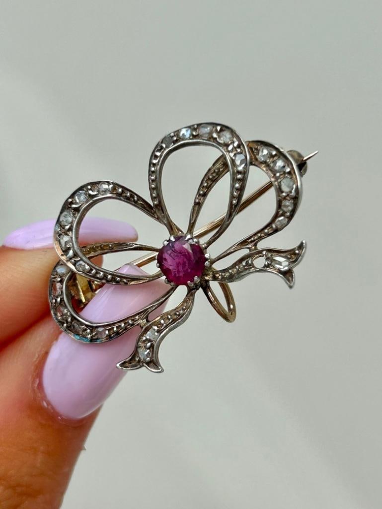Natural Ruby and Diamond Large Bow Brooch: Natural Ruby and Diamond Large Bow Brooch pretty bow brooch measurements length 34mm width 23mm weight 5.28g materials ruby and diamond DC2