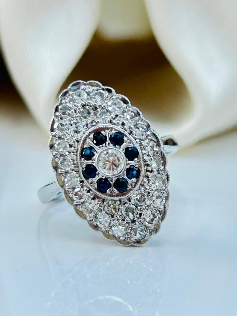 18ct White Gold Diamond and Sapphire Floral Navette Ring: 18ct White Gold Diamond and Sapphire Floral Navette Ring the prettiest ring, truly delightful! measurements size UK L1/2 US 6 head of ring 20mm x 13mm weight