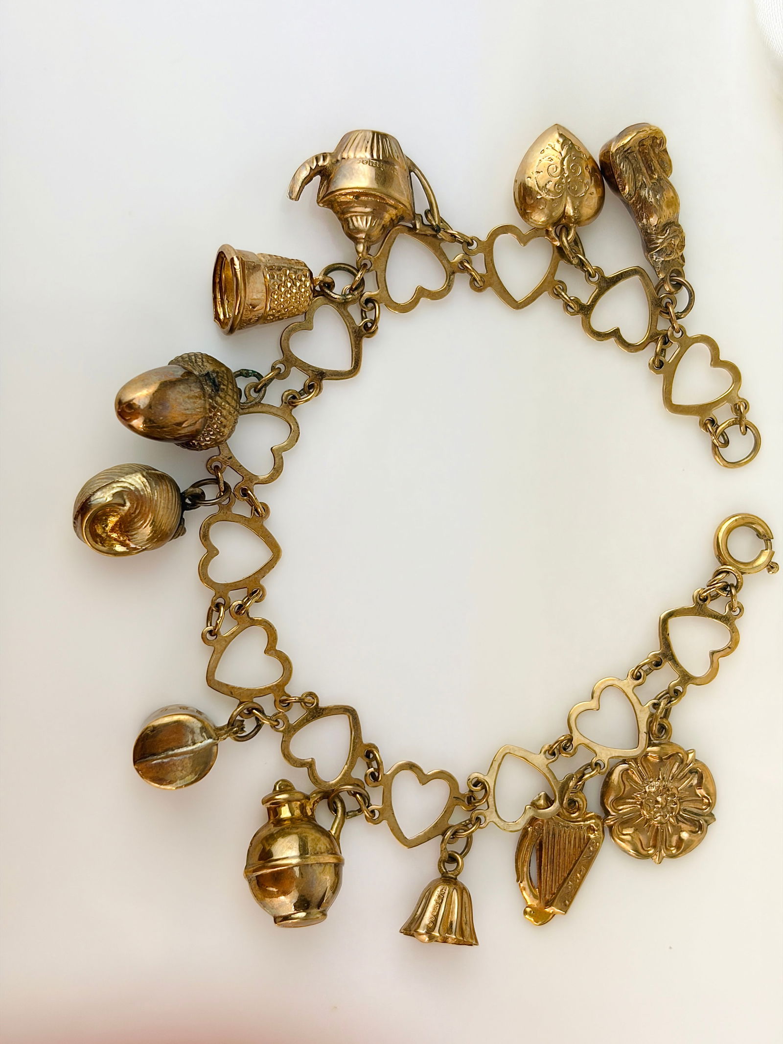 vintage hearts bracelet full of charms all in 9ct gold - 2