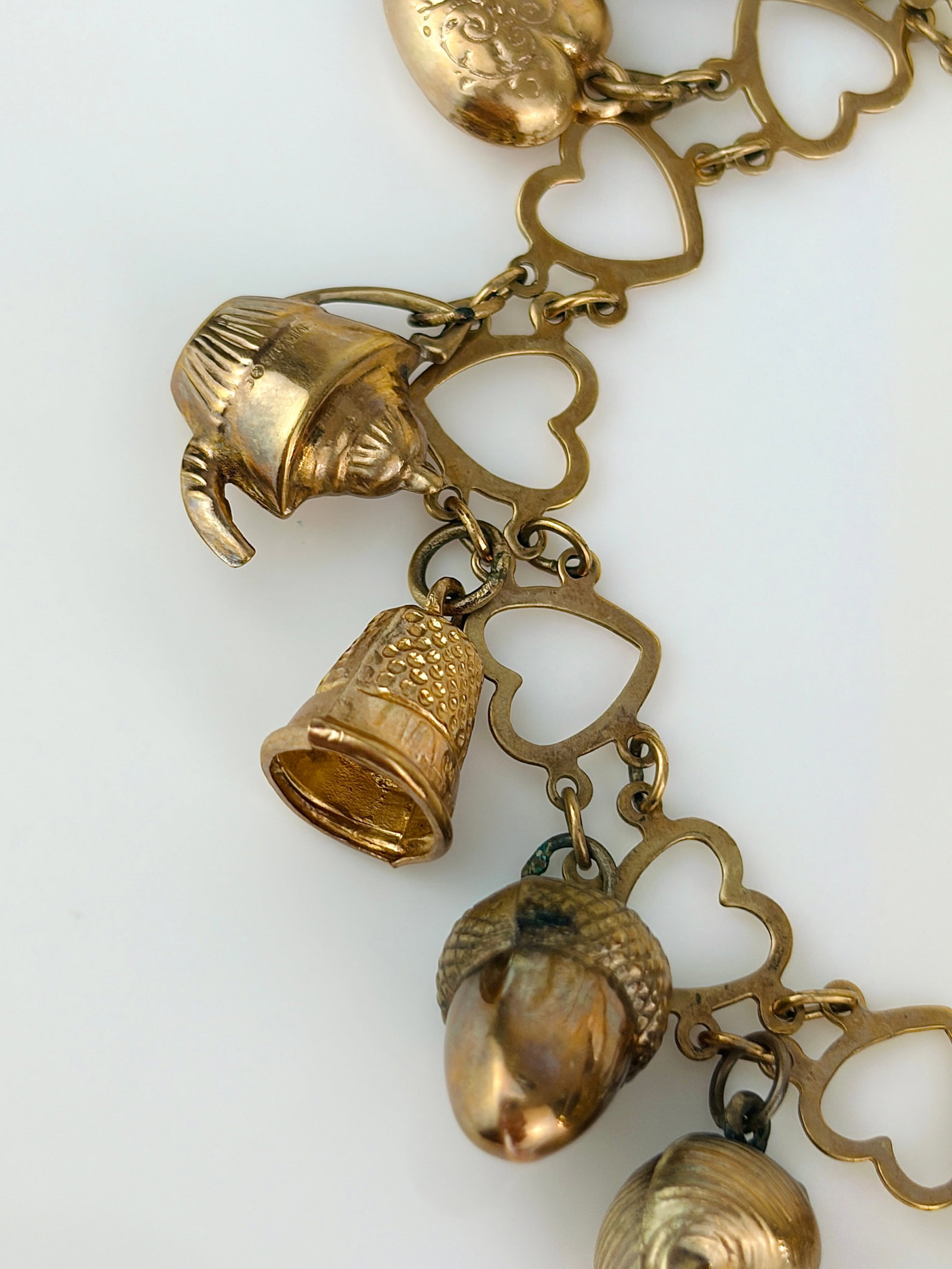vintage hearts bracelet full of charms all in 9ct gold - 4