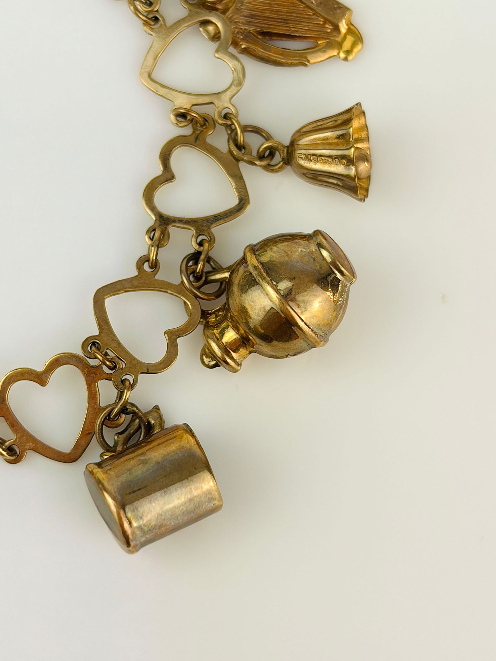 vintage hearts bracelet full of charms all in 9ct gold - 6