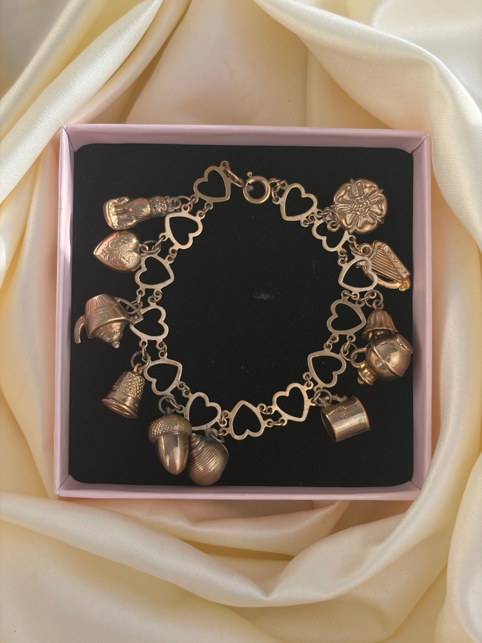 vintage hearts bracelet full of charms all in 9ct gold - 8