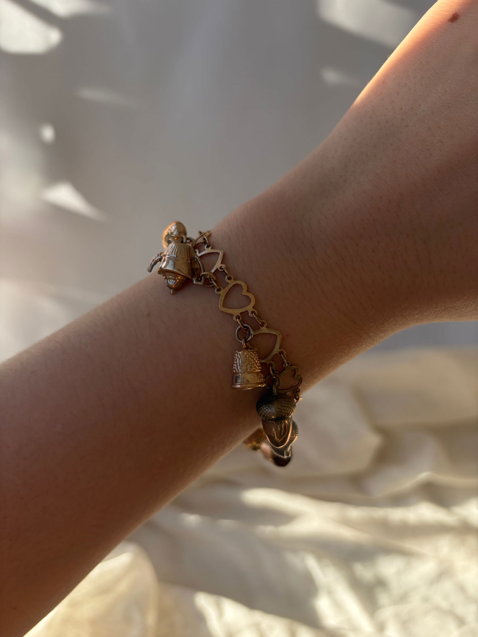 vintage hearts bracelet full of charms all in 9ct gold - 9