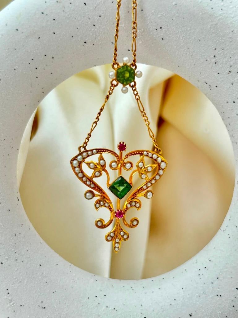 Amazing 15ct Yellow Gold Peridot Pearl and Ruby Pendant: Amazing 15ct Yellow Gold Peridot Pearl and Ruby Pendant truly the most beautiful gemset pendant measurements length 40.5cm pendant size 58mm x 30mm weight 7.75g stamped 15ct