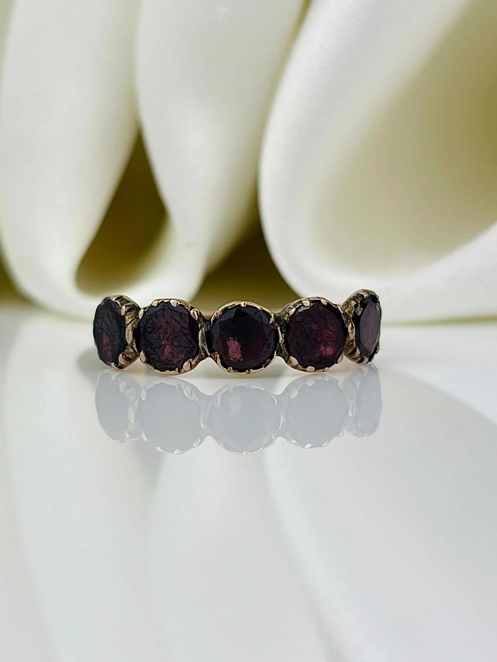 georgian era flat cut garnet half hoop band ring in gold: georgian era flat cut garnet half hoop band ring in gold Gorgeous garnet ring that is a quintessential piece of Georgian era jewellery! Weight: 0.96g Size: UK K1/2, US 5.75, Width 4mm,