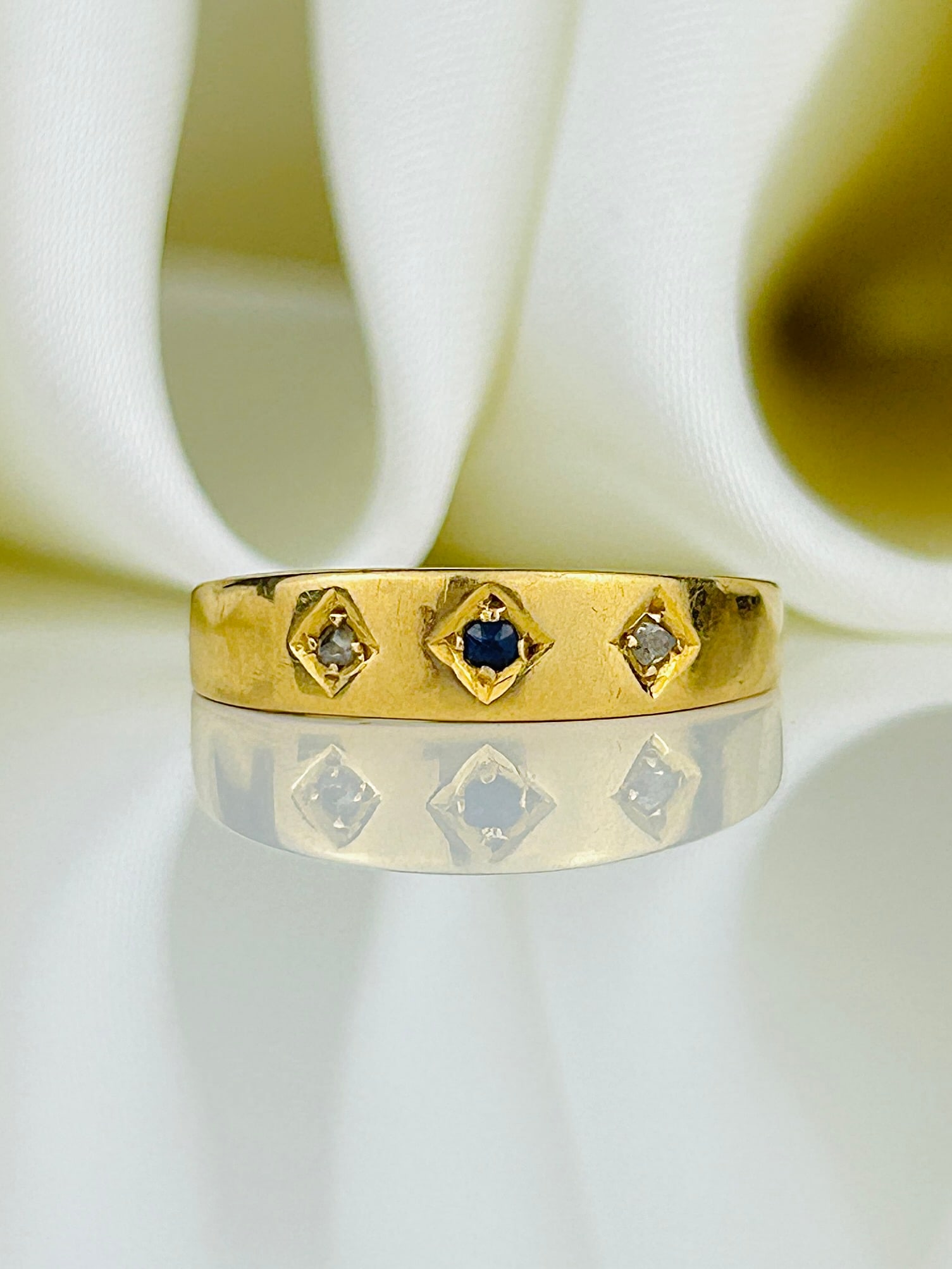 Sweet Antique Sapphire and Diamond 3 Stone in 18ct Yellow Gold: Sweet Antique Sapphire and Diamond 3 Stone in 18ct Yellow Gold Weight: 2.24g Size: UK N, US 7, Height 4mm, Height off finger 1mm Materials: 18ct gold Hallmarks: Fully hallmarked 18, Birmingham,