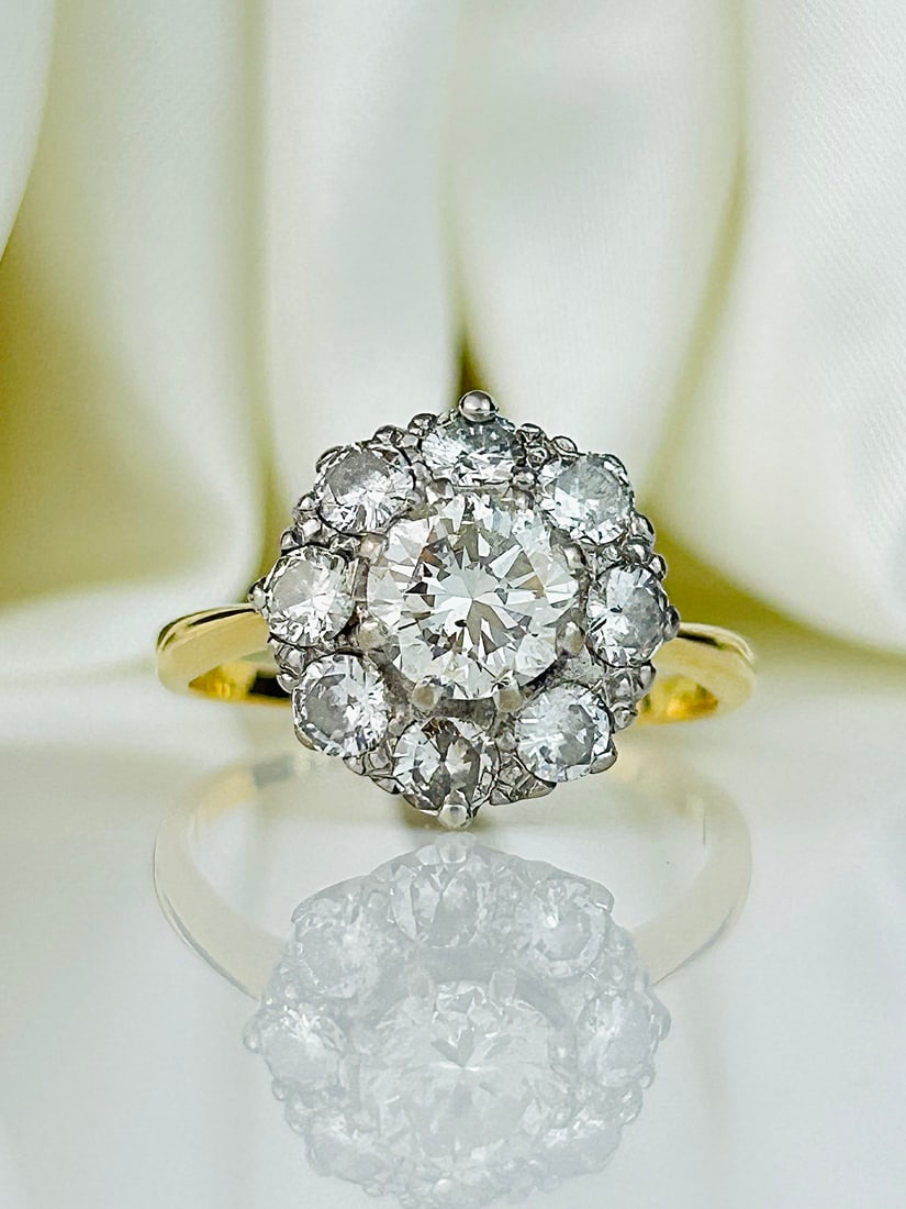 Incredible 18ct Gold and Platinum 2ct Total Diamond Cluster Ring: Incredible 18ct Gold and Platinum 2ct Total Diamond Cluster Ring Weight: 4g Size: UK N1/2, US 7.25, Face of ring 13x13mm, Height off finger 7mm Materials: 18ct Gold and Platinum Condition: The