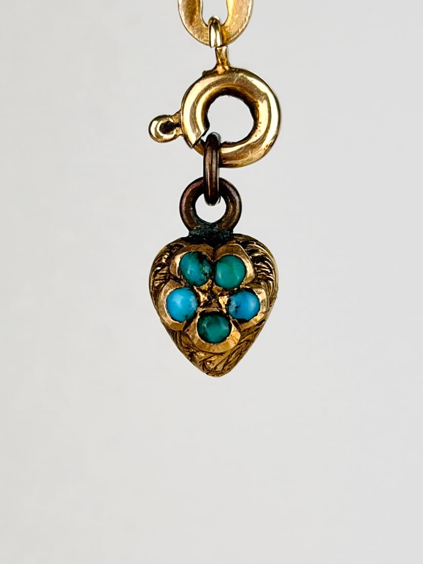 Tiny Antique Turquoise Heart Charm with Locket Back: Tiny Antique Turquoise Heart Charm with Locket Back Weight: 0.65g Size: 10x6x5mm Materials: Gold Hallmarks: None present Condition: The overall condition is very good Office Use: DZZ The