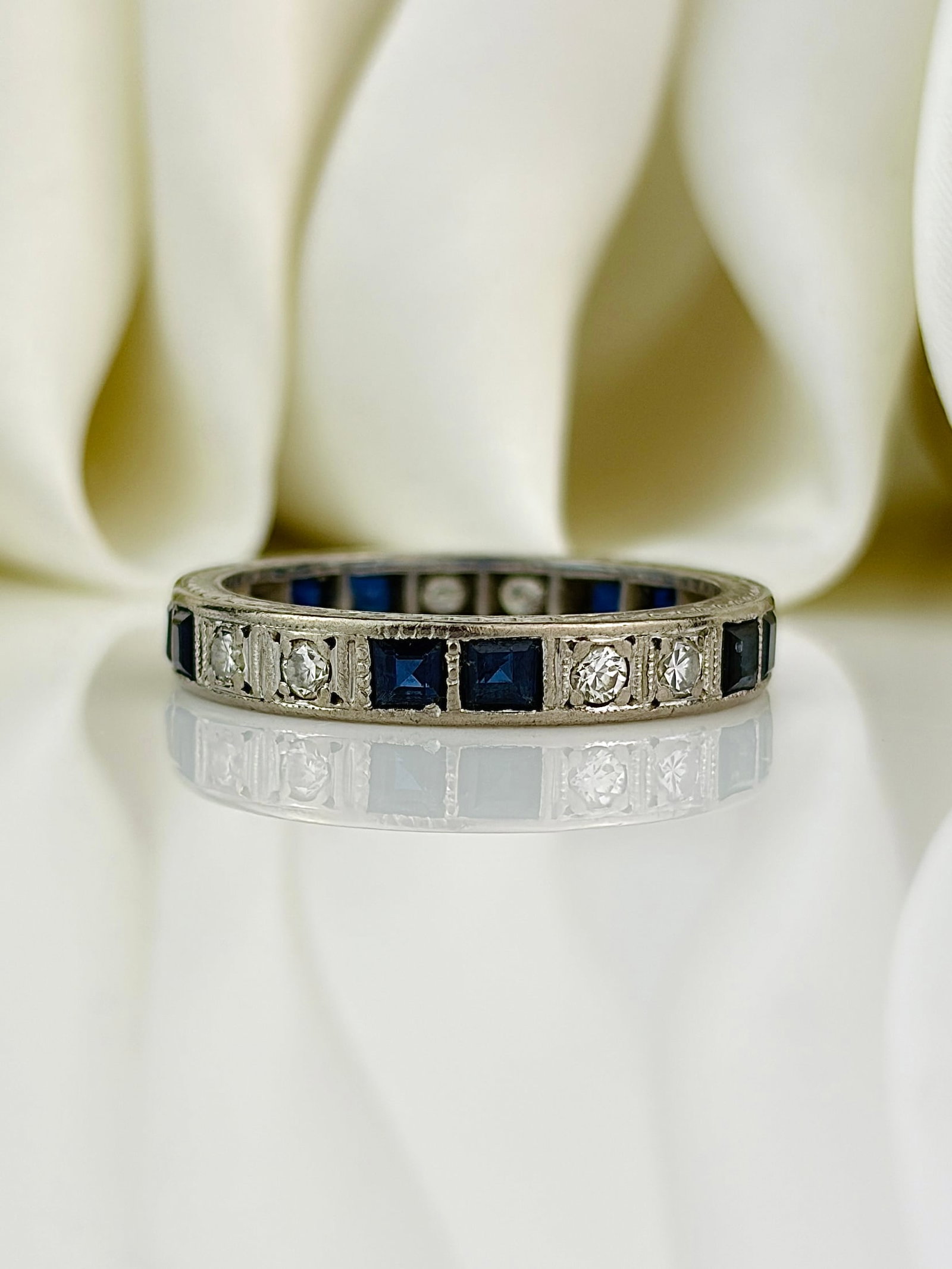 Antique platinum sapphire and diamond full eternity band ring with bevelled edging: Antique platinum sapphire and diamond full eternity band ring with bevelled edging
