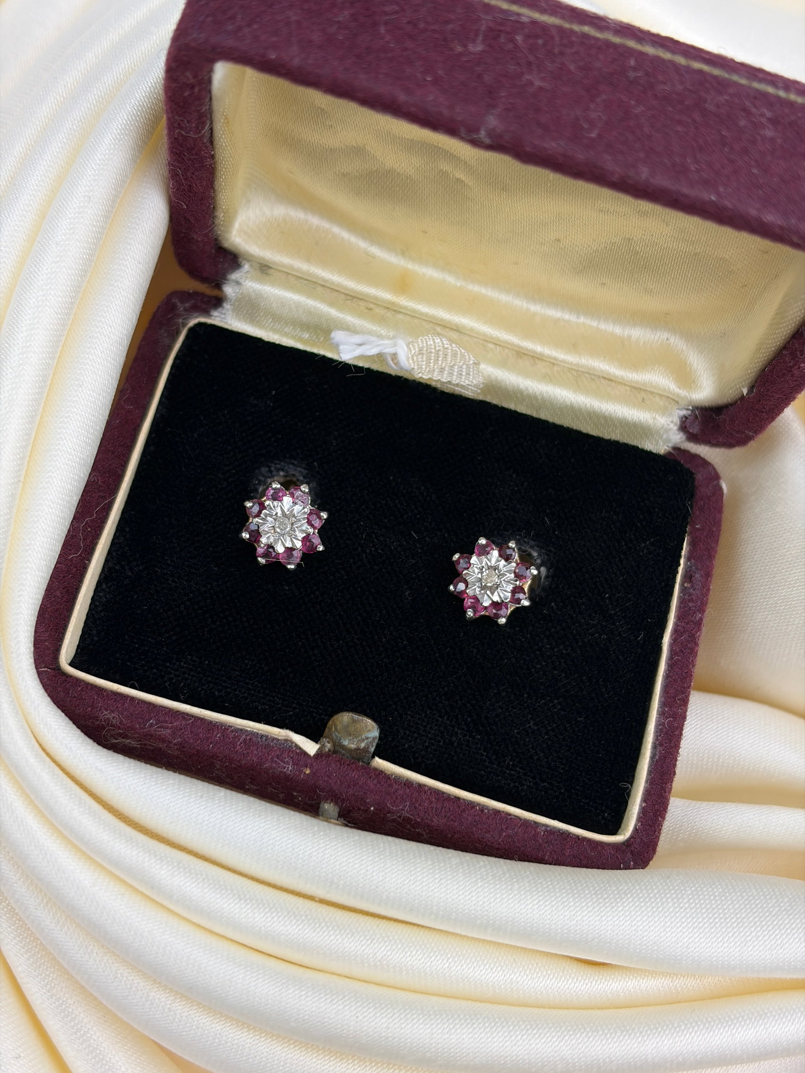 Sweet Ruby and Diamond Flower Earrings in Gold in Box: sweet ruby and diamond flower earrings in gold in box So sweet! Weight: 1.5g Size: 7x7mm face, depth 4mm Materials: 9ct gold Hallmarks: Stamped 375 Condition: Very good overall