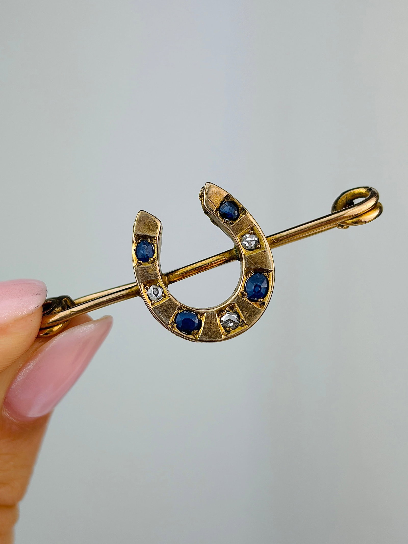Antique Gold Sapphire and Diamond Horseshoe Safety Pin Brooch in Gold