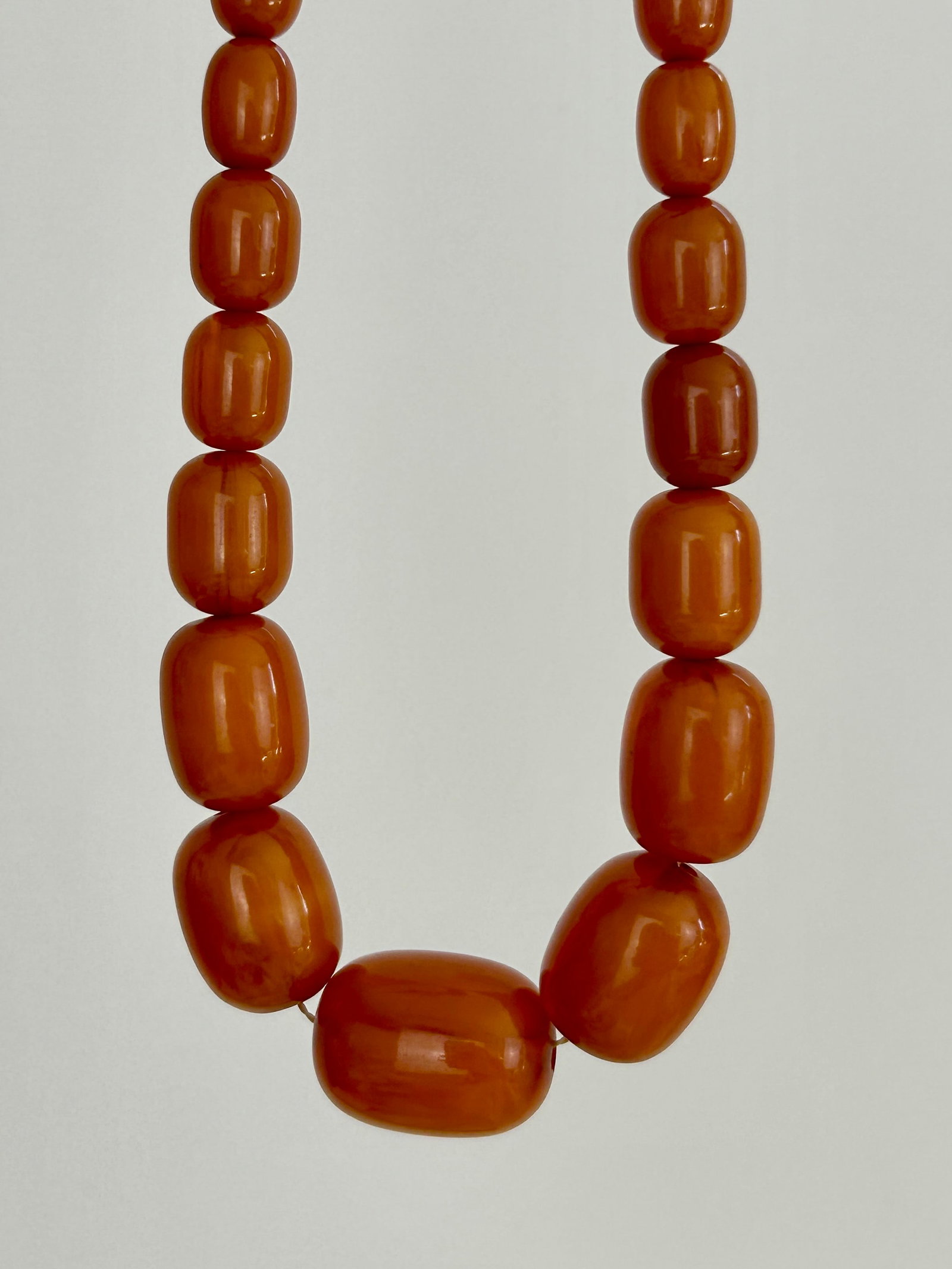 Amber/Bakelite Bead Necklace:  Amber/Bakelite Bead Necklace Length 80cm Weight 79.3g Largest bead 28x20mm