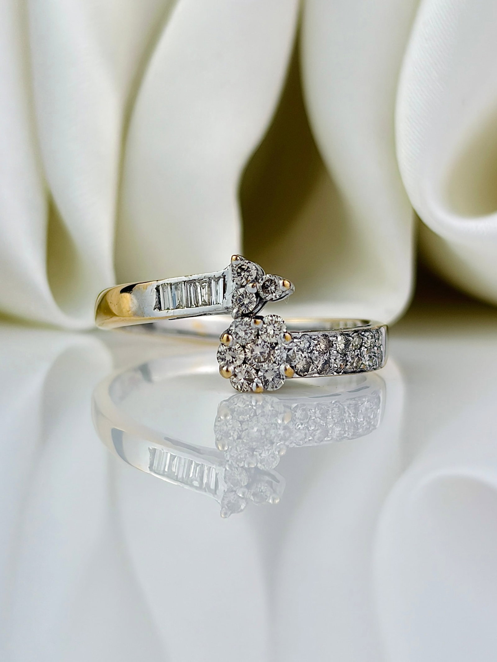 18ct white gold diamond twist ring - unusual design: 18ct white gold diamond twist ring - unusual design with yellow gold shank Weight: 3.52g Size: UK Q, US 8.5, Width 8.5mm, height off finger 3mm Materials: 18ct gold Hallmarks: stamped