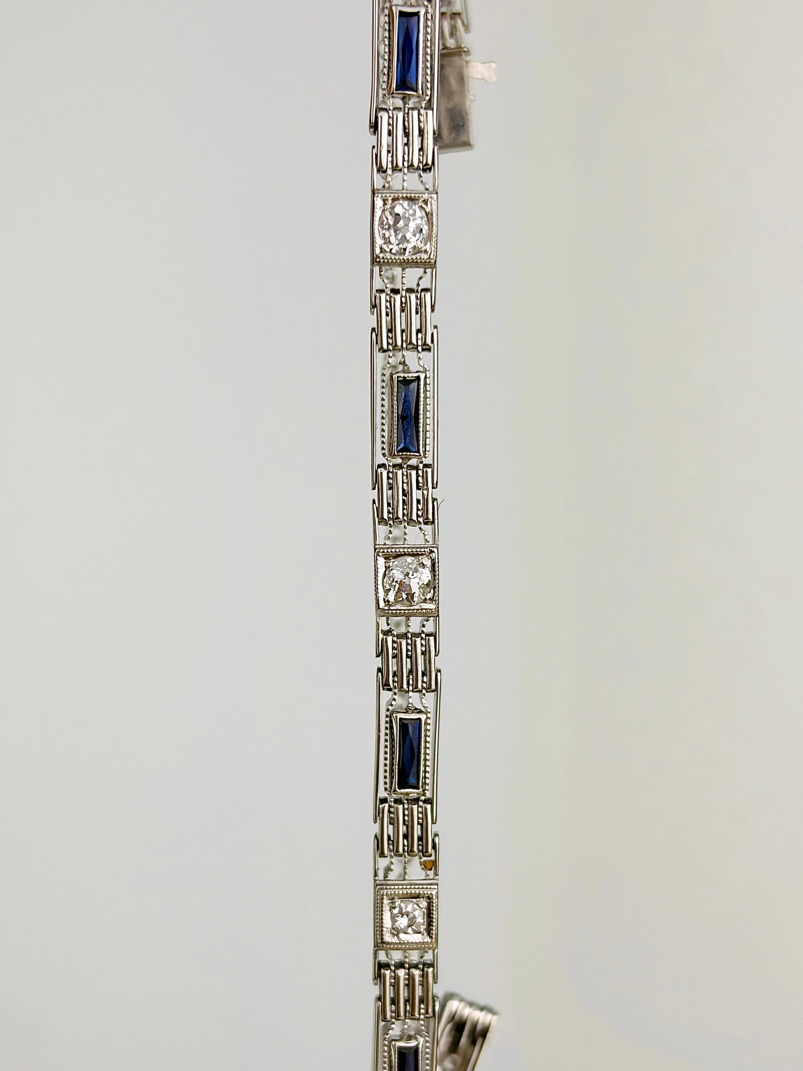 Art Deco Diamond and Sapphire 18 Carat White Gold Bracelet: Art Deco Diamond and Sapphire 18 Carat White Gold Bracelet Stunning bracelet encrusted with sparkling diamonds and deep blue sapphires all set in 18carat white gold. Sapphire total 80pts and