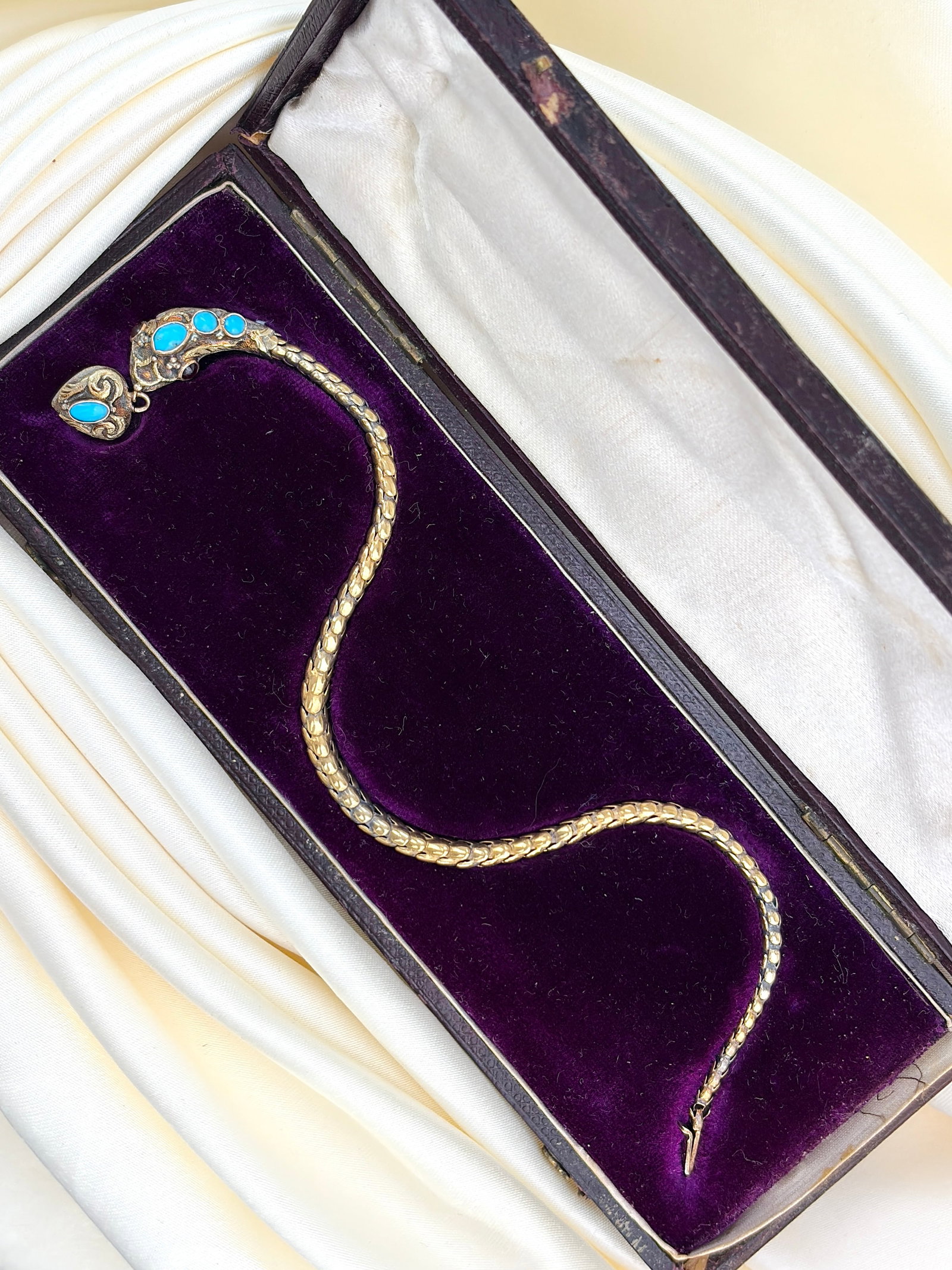 Antique Yellow Gold Turquoise Snake Bracelet in Fitted Box: antique yellow gold turquoise snake bracelet in fitted box Incredible piece of craftsmanship! Weight: 9.28g Size: Length around wrist 20cm, Width of head 9mm Materials: Yellow