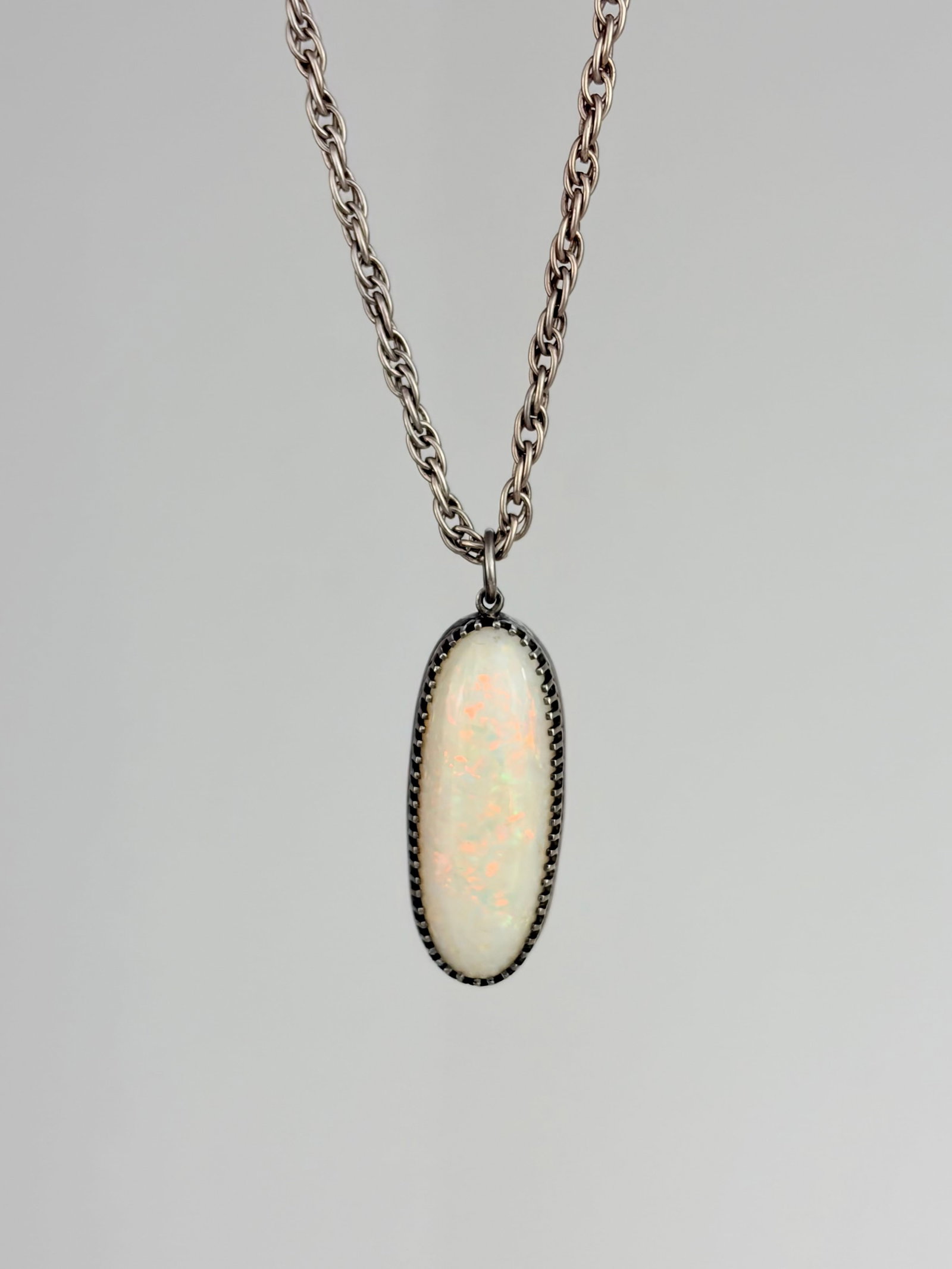 SILVER LARGE OPAL PENDANT ON CHAIN: SILVER LARGE OPAL PENDANT ON CHAIN Weight 17.3g Length 61.5cm, pendant 39x13mm