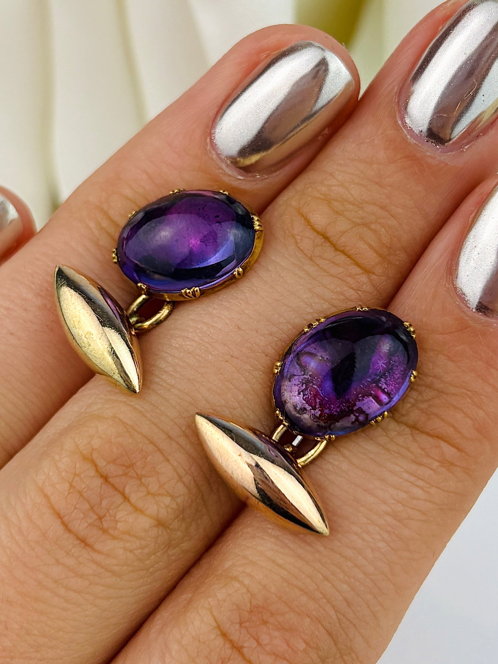Antique Gold and Cabochon Amethyst Torpedo Cuff Links: Antique Gold and Cabochon Amethyst Torpedo Cuff Links Weight: 4.16g Size: 23mm, Amethyst 13x9mm depth 4mm Materials: Gold Hallmarks: None present Condition: The overall condition is