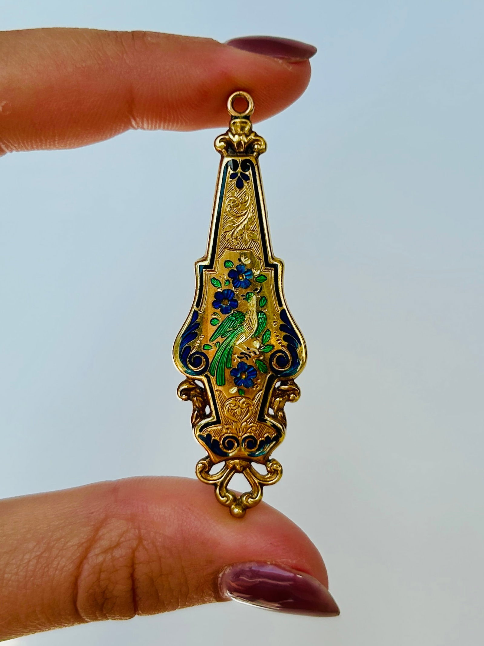Antique Enamel Floral Pendant in 22ct Gold: Antique Enamel Floral Pendant in 22ct Gold Weight: 2.61g Size: 54x17mm Materials: 22ct gold Hallmarks: None present, tests as 22ct gold Condition: The overall condition is very good, there is no