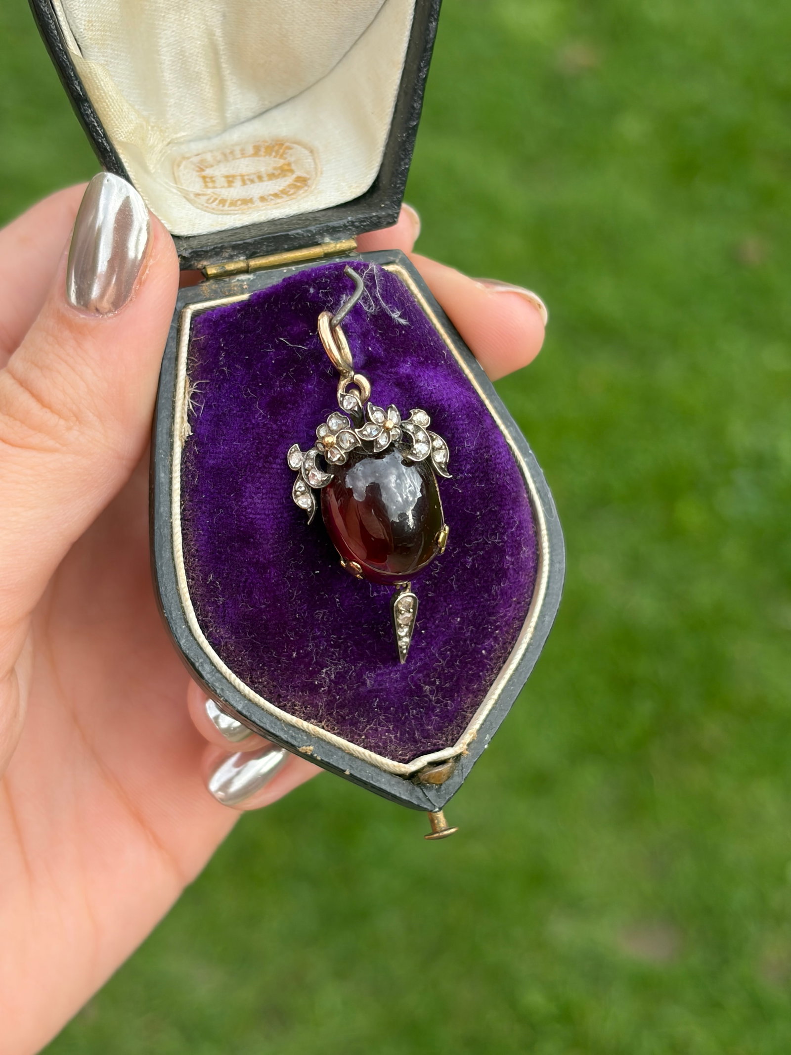 Victorian Boxed Cabochon Garnet and Rose Cut Diamond Locket Back Pendant in Gold: Victorian Boxed Cabochon Garnet and Rose Cut Diamond Pendant in Gold with Locket Back Weight: 7.16g Size: 42x17mm, depth 10.5mm Materials: Gold Hallmarks: None present Condition: The overall