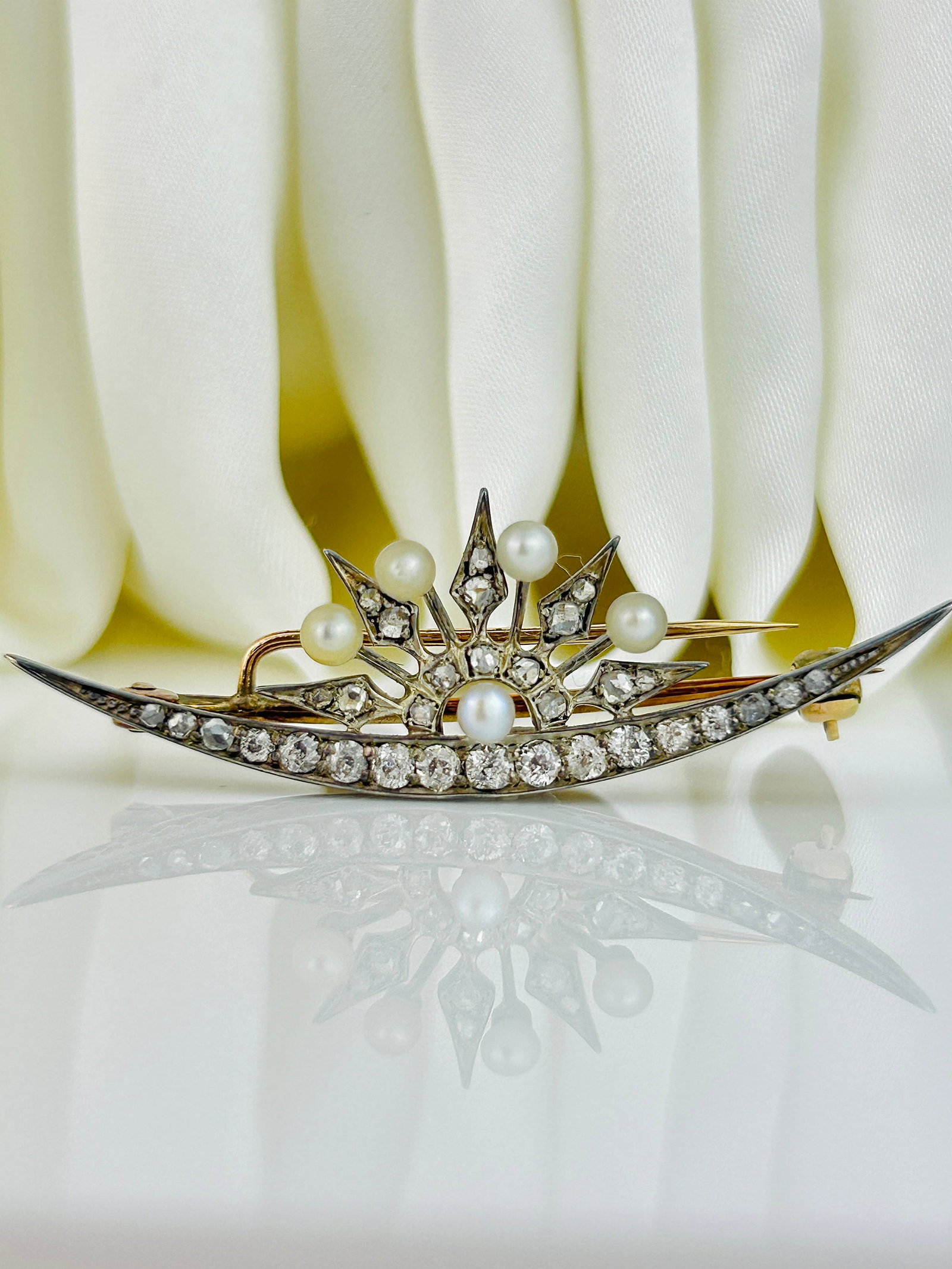 Antique Victorian Old Cut Diamond and Pearl Crescent Moon and Star Brooch: Antique Victorian Old Cut Diamond and Pearl Crescent Moon and Star Brooch Weight: 5.09g Size: 15x48mm Materials: Gold Hallmarks: None present Condition: The overall condition is very good