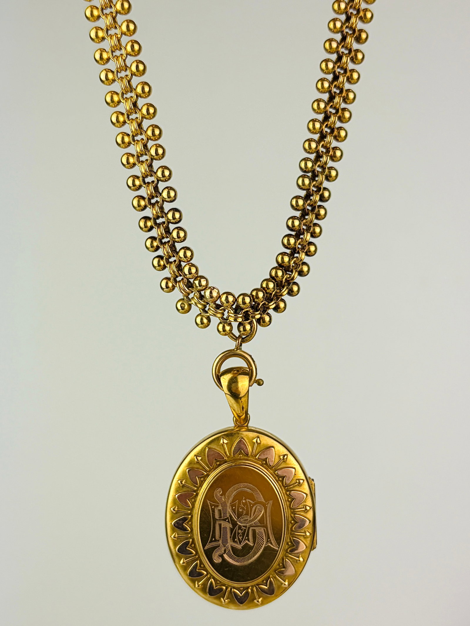 victorian era 18ct yellow gold collar and locket set: victorian era 18ct yellow gold collar and locket set Amazing collar necklace with ball detailing in a butter 18ct yellow gold, holding with a clasp (so can be taken off) a heart detailed large locket 