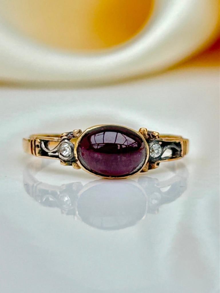 Georgian Cabochon Garnet and Diamond Ring in Gold: Georgian Cabochon Garnet and Diamond Ring in Gold outstanding glowing cabochon garnet with sweet diamond shoulders, truly exquisite! measurements size UK P US 8 head of ring 8mm x 
