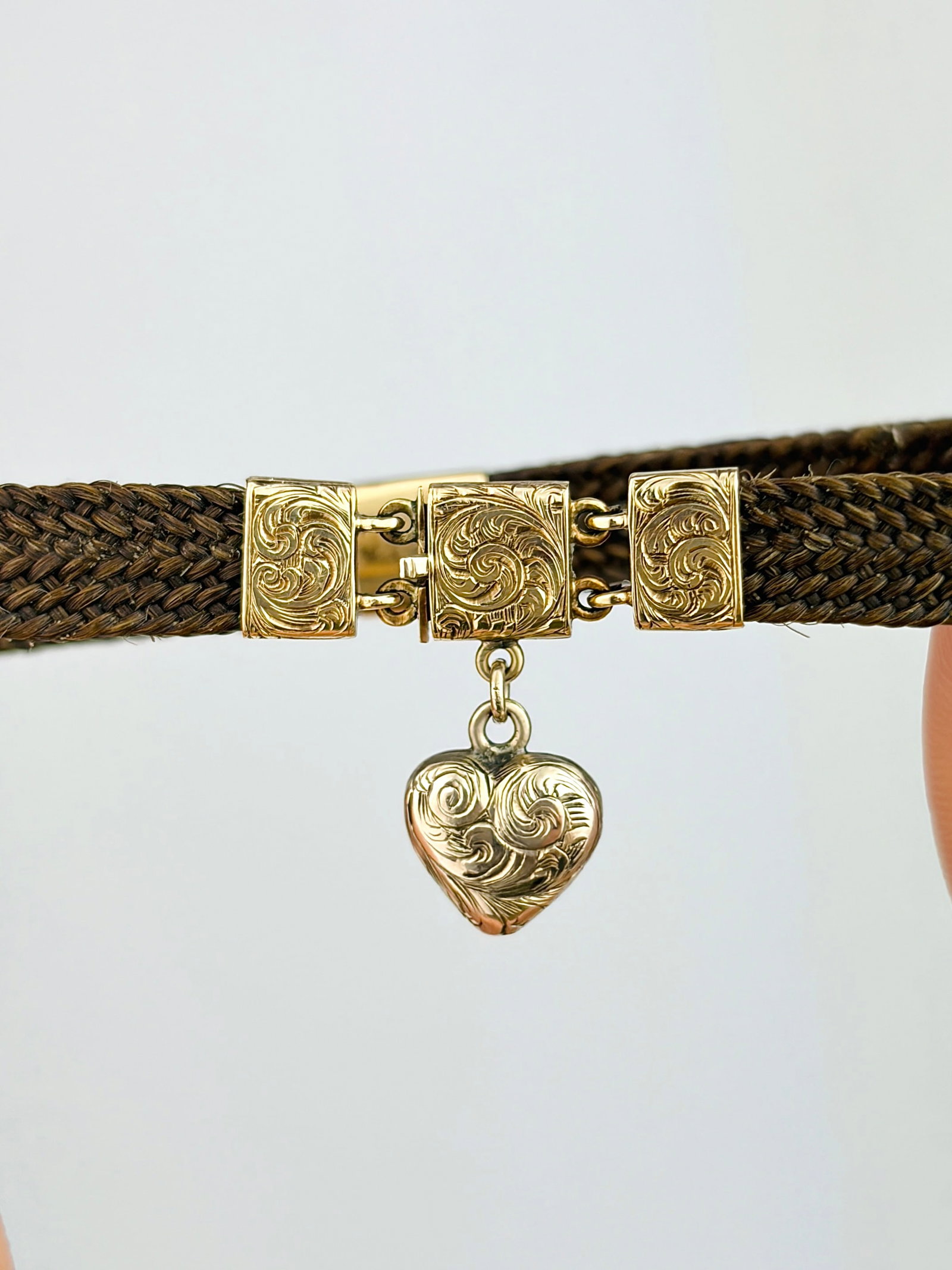 ANTIQUE VICTORIAN MOURNING HAIR BRACELET WITH 9ct GOLD DETAILS AND HEART DROP: ANTIQUE VICTORIAN MOURNING HAIR BRACELET WITH GOLD DETAILS AND HEART DROP A truly incredible piece of jewellery that was made to honour the life of a loved one!