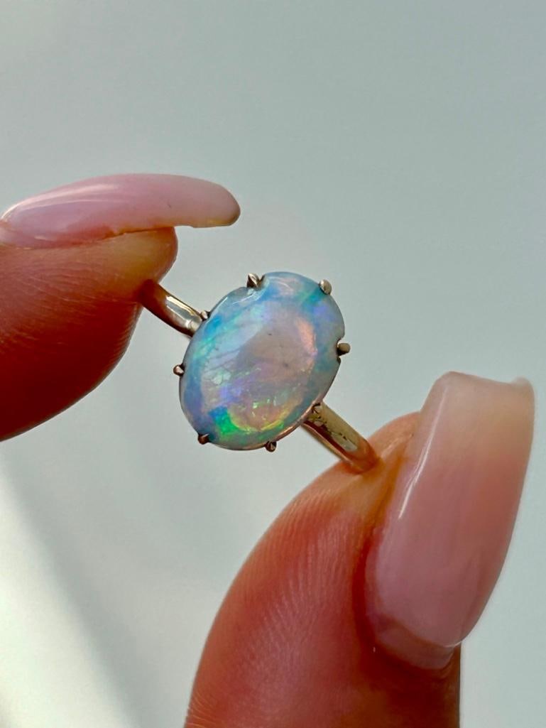 Wonderful Opal Ring in 14ct Yellow Gold: Wonderful Opal Ring in 14ct Yellow Gold sweet and fiery opal stone measurements ring size UK K1/2 US 51/2 head of ring 12mm x 7mm weight 2.84g 