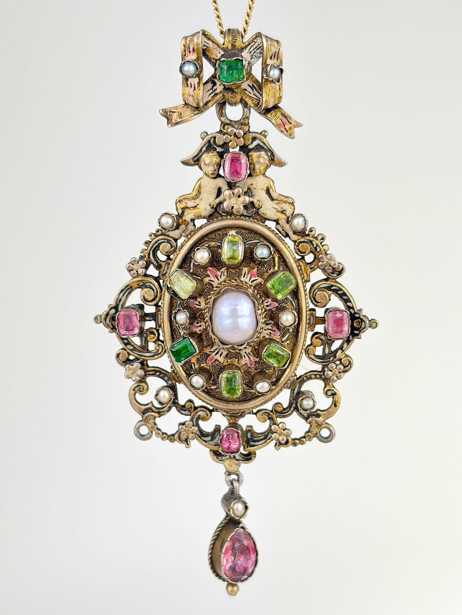 ANTIQUE RARE AUSTRO HUNGARIAN ENAMEL, PEARL, PINK AND GREEN SPINEL LARGE PENDANT WITH LOCKET: ANTIQUE RARE AUSTRO HUNGARIAN ENAMEL, PEARL, PINK AND GREEN SPINEL LARGE PENDANT Outstanding large pendant featuring so many amazing details such as a bow top, small enamel figures and flowers, as