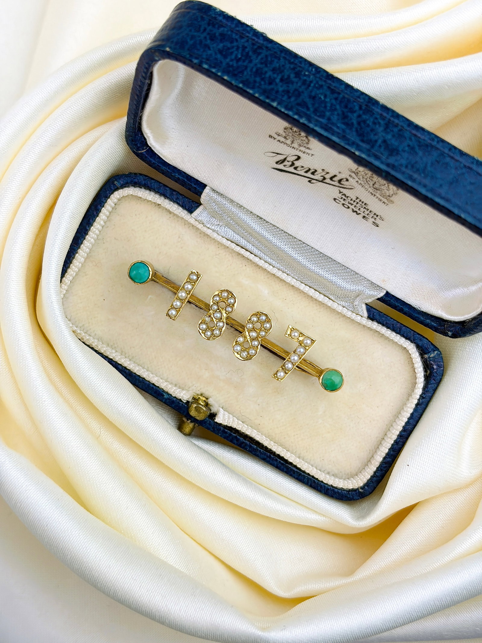 ANTIQUE BOXED TURQUOISE AND PEARL '1887' BAR BROOCH IN GOLD: ANTIQUE BOXED TURQUOISE AND PEARL '1887' BAR BROOCH IN GOLD A lovely little brooch inscribed '18th July'