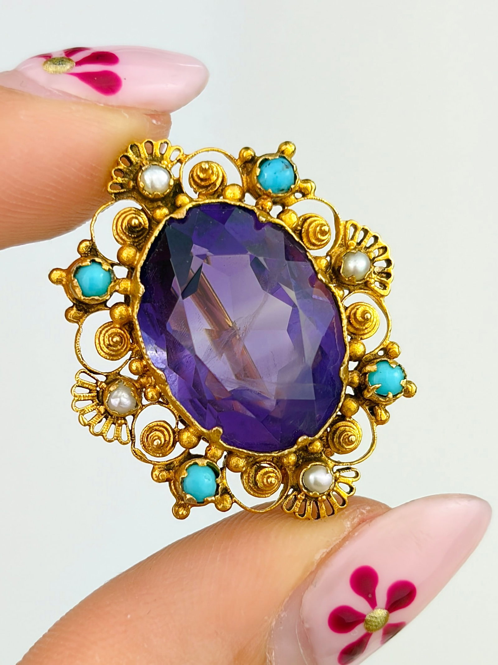 ANTIQUE 9CT YELLOW GOLD AMETHYST, PEARL AND TURQUOISE BROOCH: ANTIQUE 9CT YELLOW GOLD AMETHYST, PEARL AND TURQUOISE BROOCH A stunning combination of stones set in an intricately designed gold!