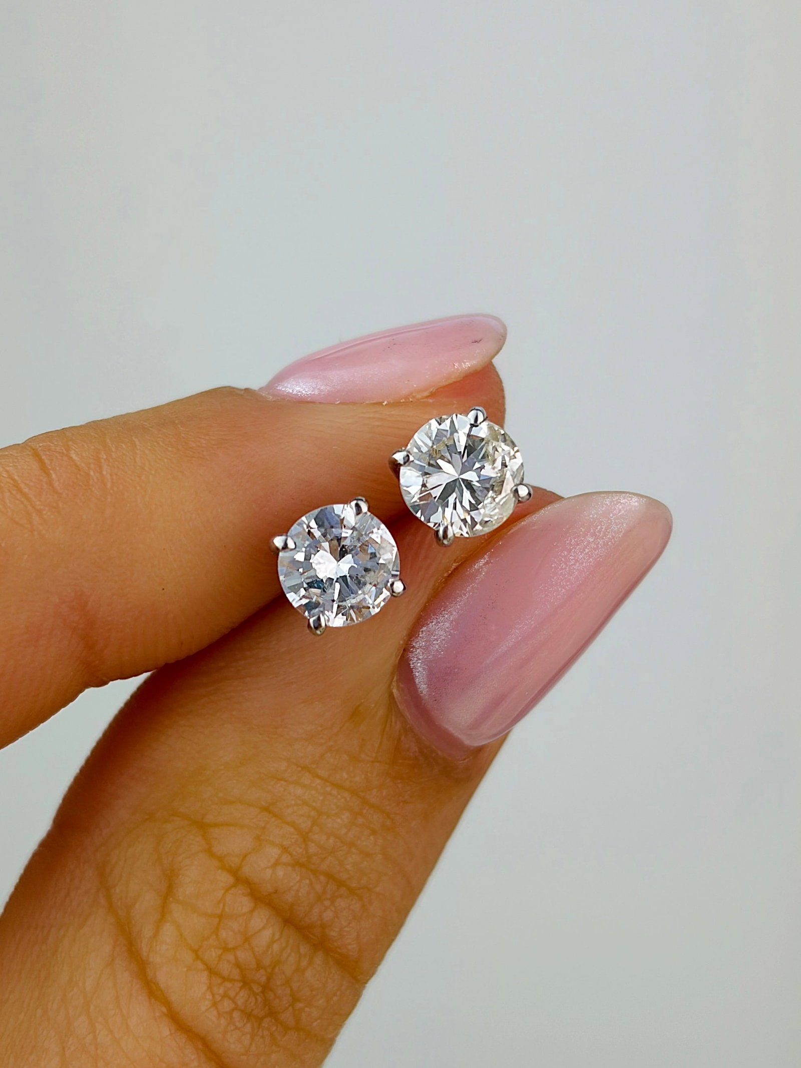 1.50cts Diamond and 18 Carat White Gold Stud Earrings: Diamond and 18 Carat White Gold Stud Earrings A pretty pair of shimmering diamond stud earrings. Each earring hosts a brilliant white diamond measuring 75pts each. Modelled in 18 carat white gold.&nbs