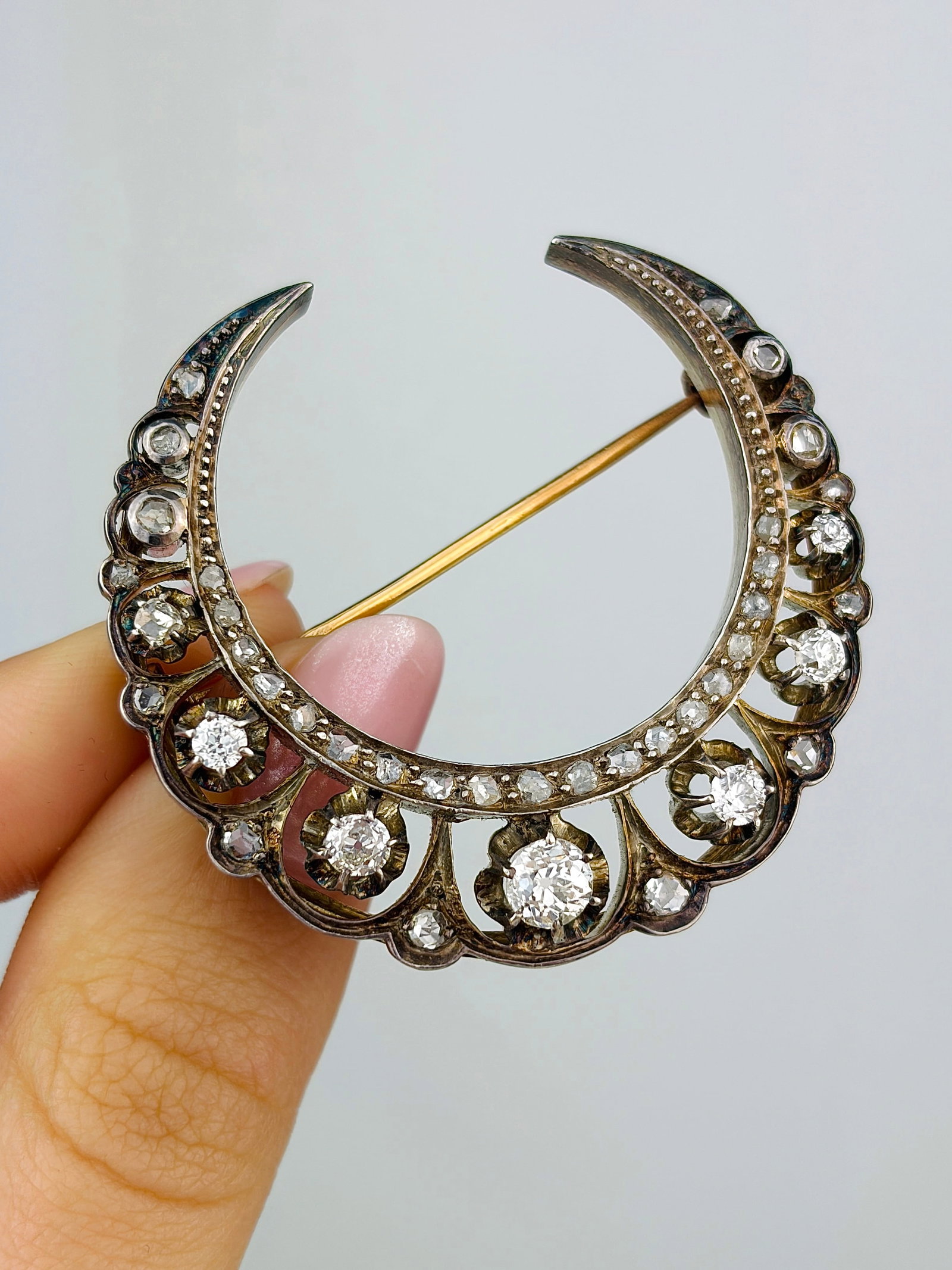 Large Art Deco Diamond 18 Carat Gold Crescent Brooch: Large Art Deco Diamond 18 Carat Gold Crescent Brooch This gorgeous crescent is modelled in 9 carat gold. The larger diamonds are old mine cut and the rest of them are rose cut. The total diamond weigh