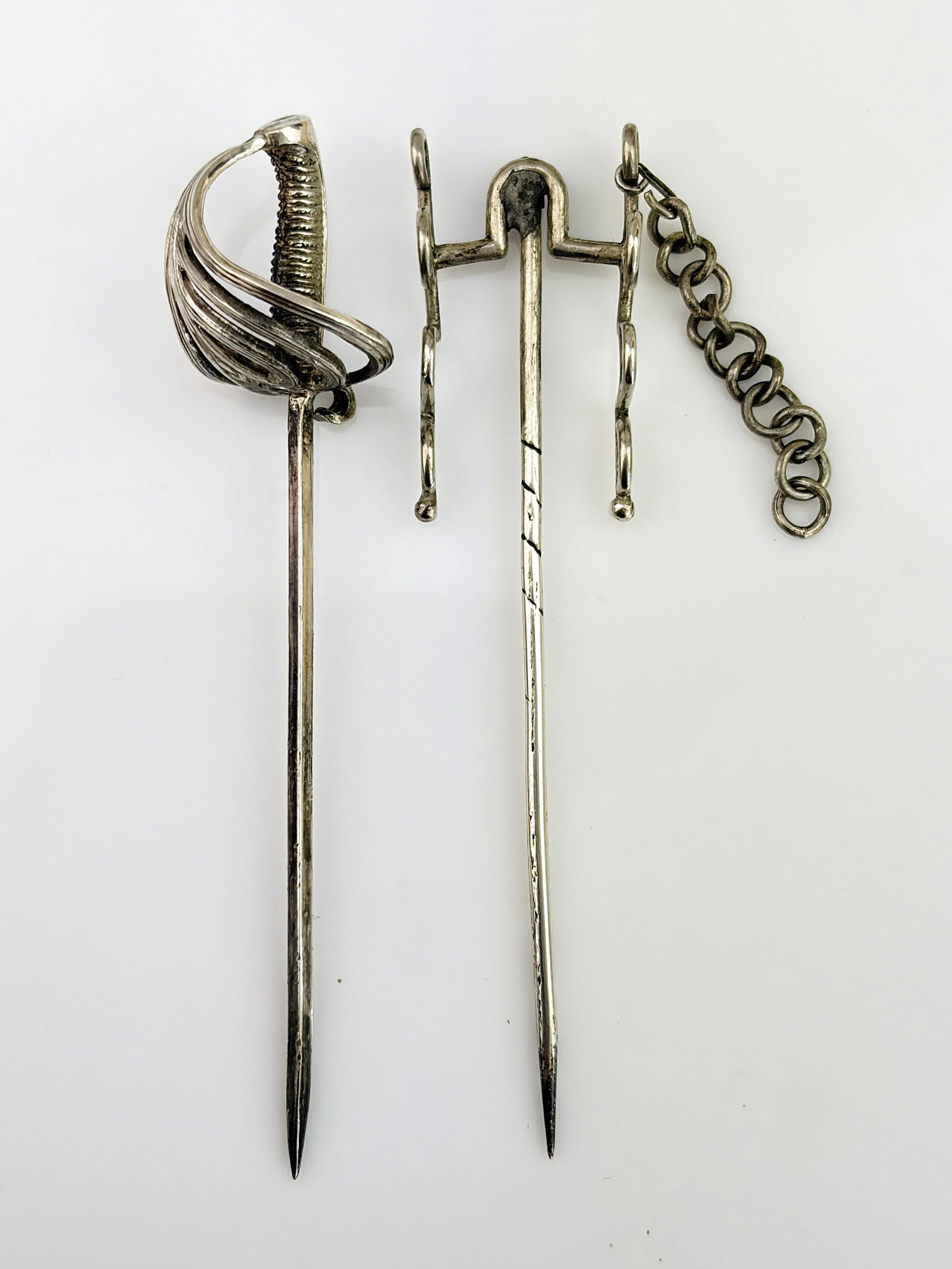 SILVER SWORD AND HOLDER STICK PIN BROOCHES: SILVER SWORD AND HOLDER STICK PIN BROOCHES