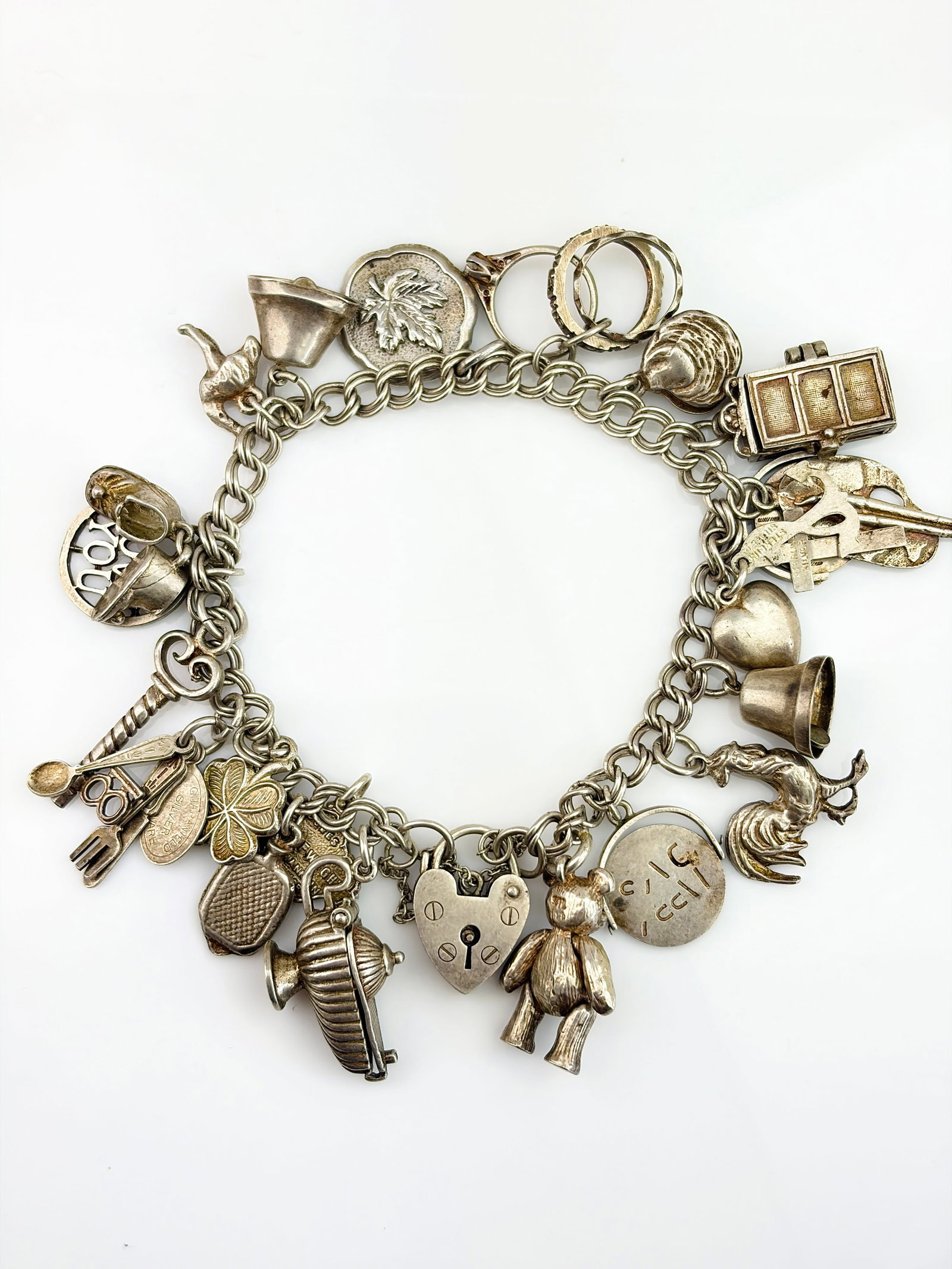 VINTAGE STERLING SILVER CHARM BRACELET WITH PADLOCK, OPENING CHARMS, SPINNERS ETC: VINTAGE STERLING SILVER CHARM BRACELET WITH PADLOCK, OPENING CHARMS, SPINNERS ETC