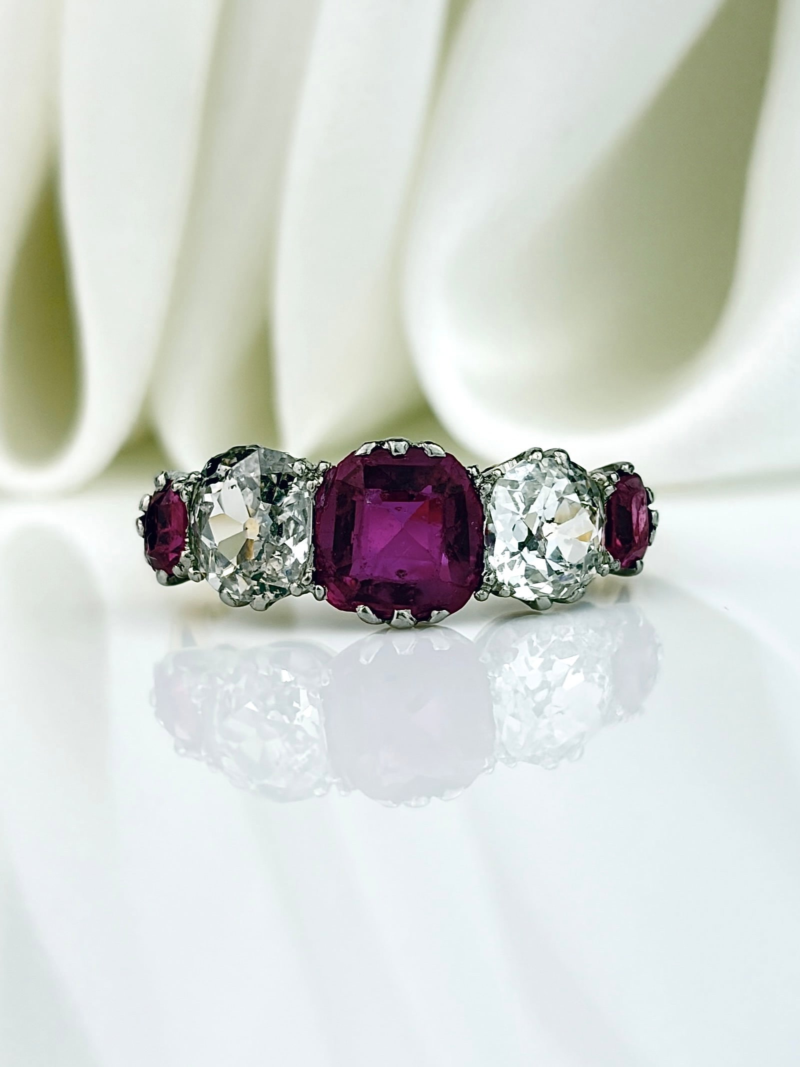 OUTSTANDING NATURAL PINK BURMA SAPPHIRE AND DIAMOND 5 STONE RING IN 18CT GOLD: OUTSTANDING PINK SAPPHIRE AND DIAMOND 5 STONE RING IN 18CT GOLD Breathtaking ring featuring three large pink sapphire stones separated by the prettiest diamonds!