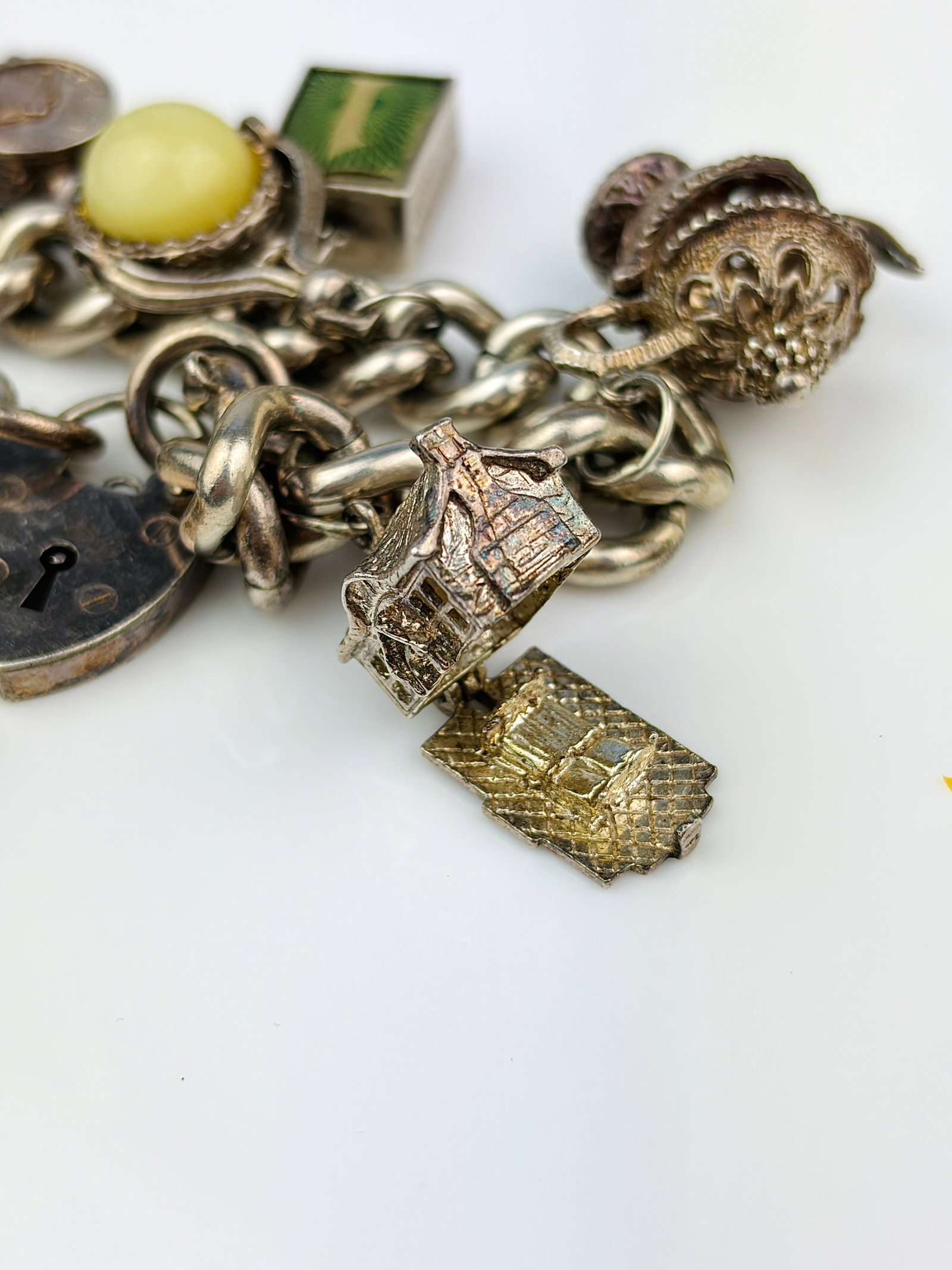 heavy silver charm bracelet with rare opening charms. - very heavy - 5