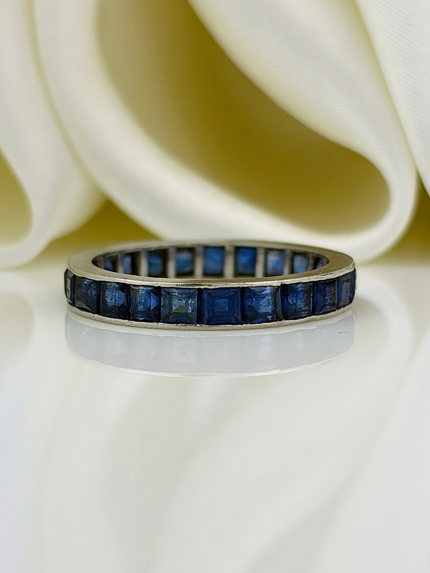 antique platinum sapphire full eternity band ring: antique platinum sapphire full eternity band ring Weight: 2.41g Size: UK K, US 5.5, Width 2mm, height off finger 1mm Materials: Platinum Hallmarks: None present Condition: Very good