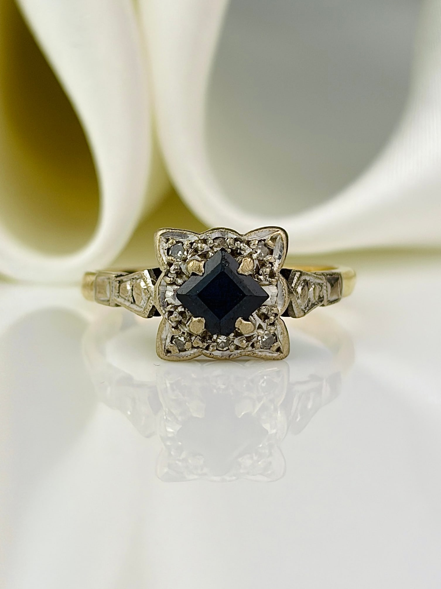 vintage 18ct yellow gold sapphire and diamond square ring: vintage 18ct yellow gold sapphire and diamond square ring The sweetest ring, with a central sapphire and diamonds set in a square white gold face, on a yellow gold shank