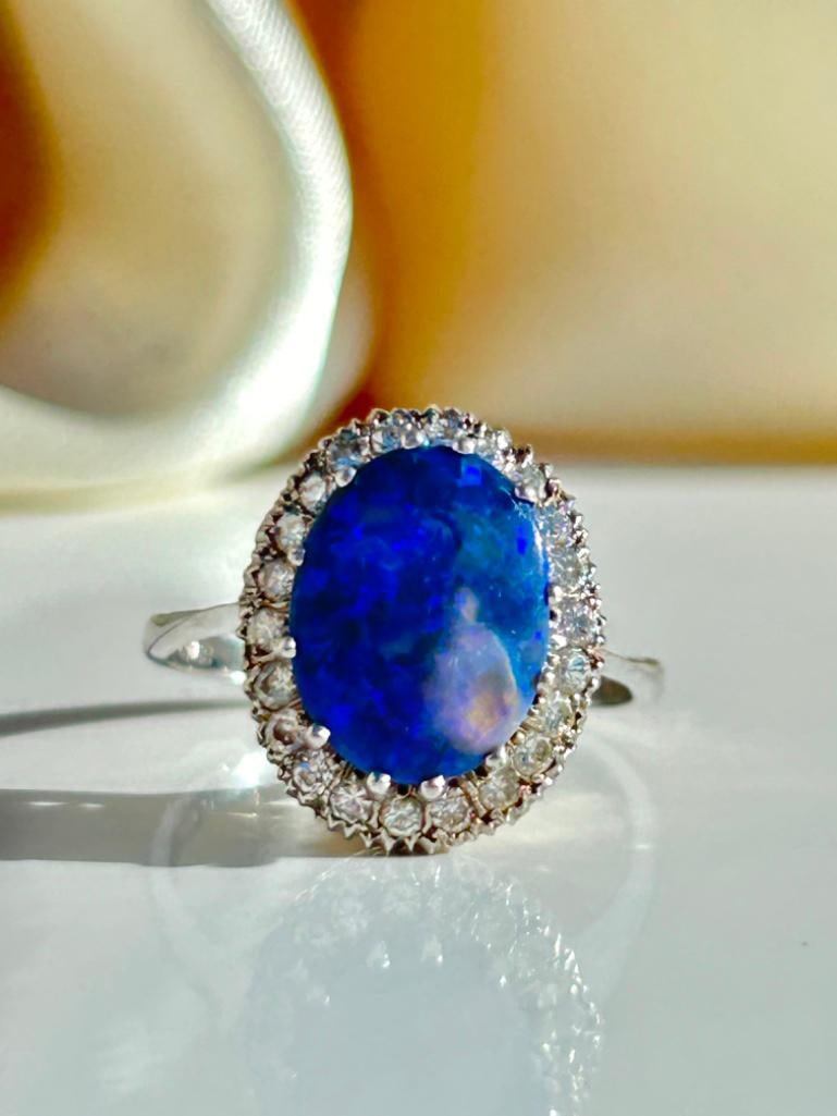 Large 18ct White Gold Black Opal and Diamond Ring: Large 18ct White Gold Black Opal and Diamond Ring incredible large fiery black opal with sweet diamond surrounding measurements size UK Q US 81/2 head of ring 15mm x 13mm weight