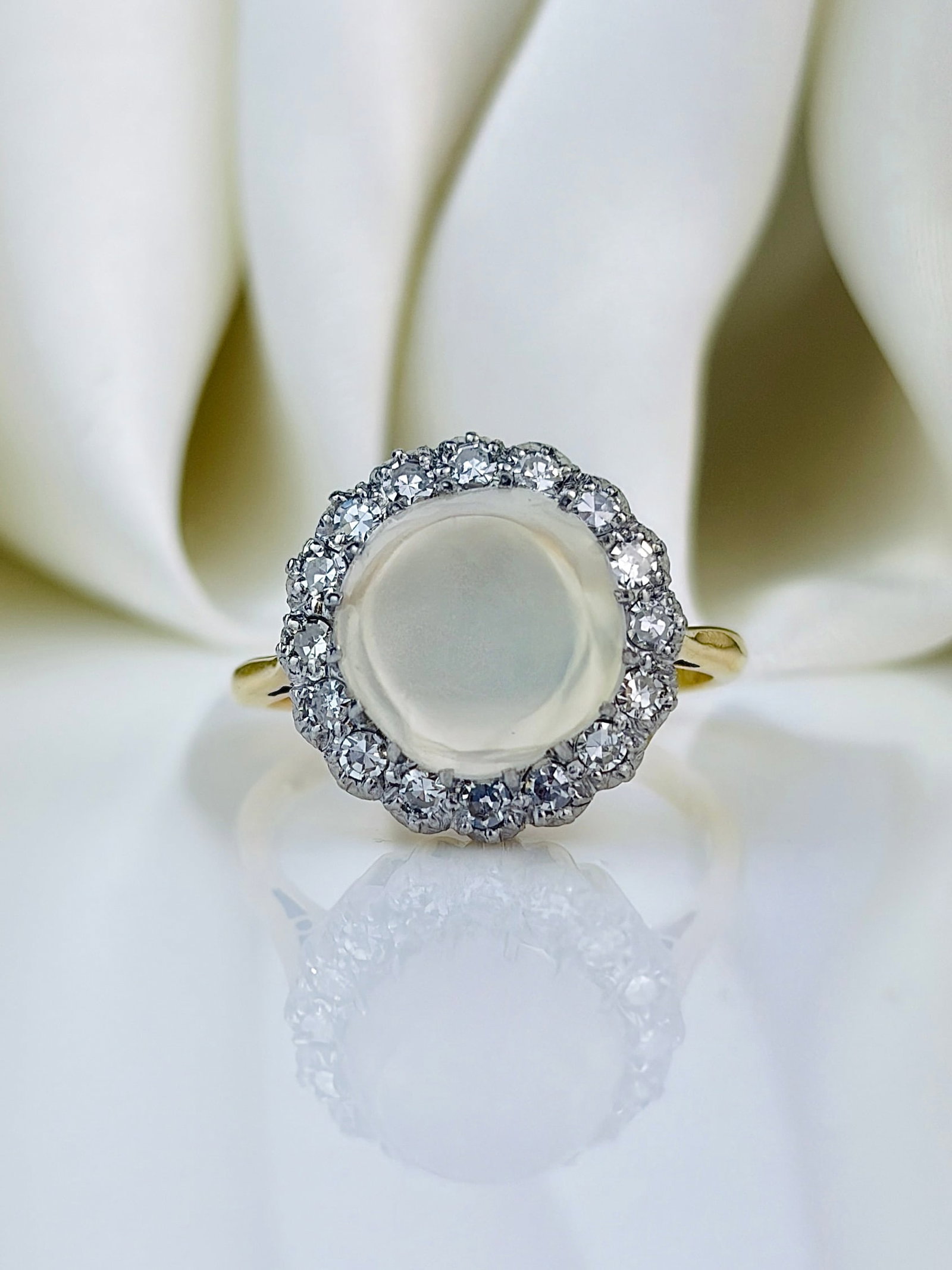 Art Deco Diamond and Moonstone 18 Carat Gold and Platinum Ring: Art Deco Diamond and Moonstone 18 Carat Gold and Platinum Ring Stunning Art Deco diamond and Moonstone ring. This ring is modelled in 18 carat gold and the stones set in platinum. The diamonds total a