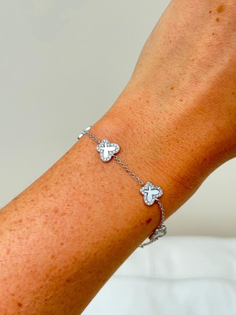 18ct white gold mother of pearl and diamond butterfly bracelet: 18ct white gold mother of pearl and diamond butterfly bracelet Dainty and delightful! measurements length 18cm width 9mm weight 5.07g materials 18ct white gold, diamond and mother of