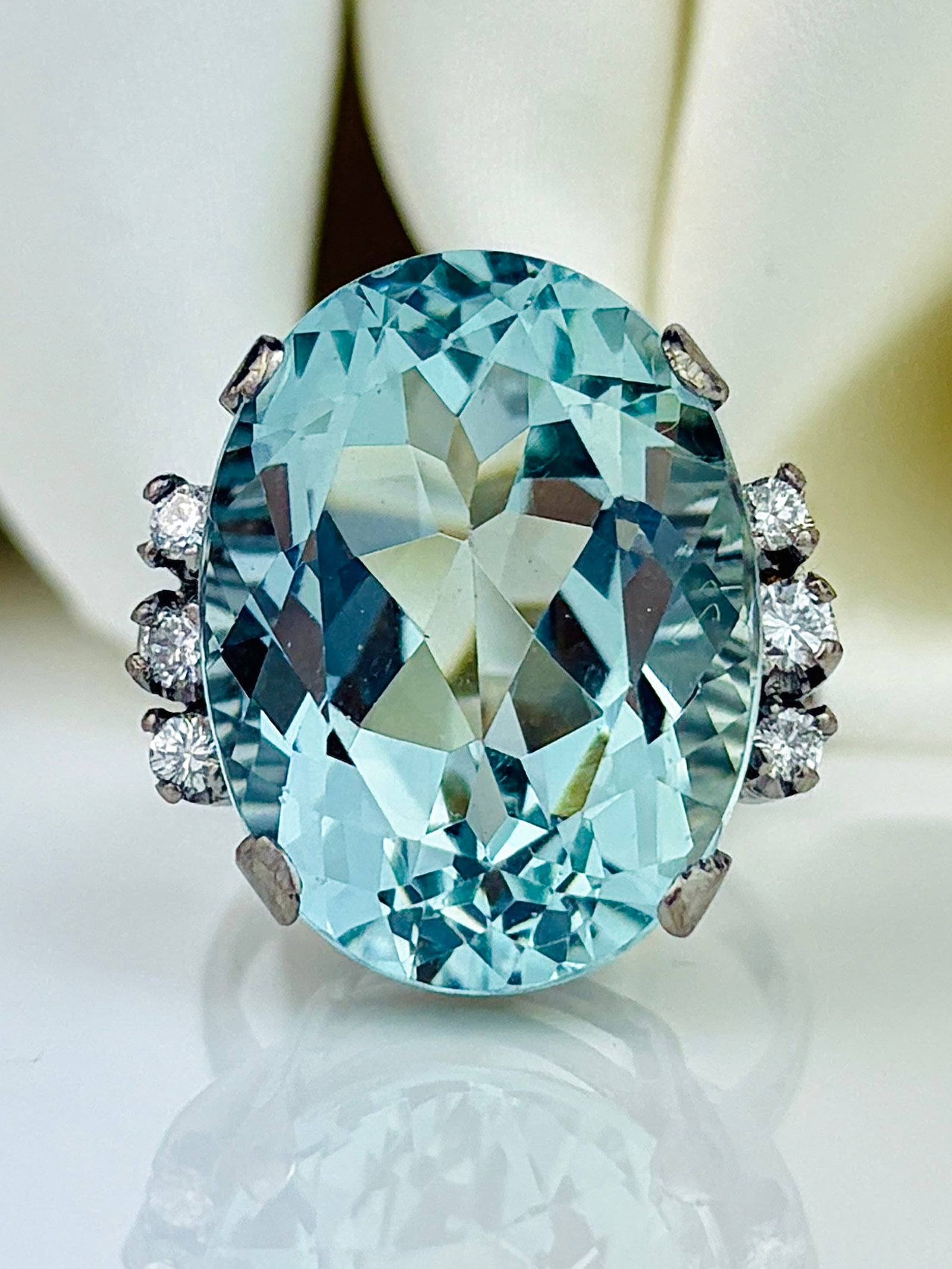Giant 18.21ct Aquamarine and Diamond Shoulder Cocktail Ring in 18ct White Gold: Giant 18.21ct Aquamarine and Diamond Shoulder Cocktail Ring in 18ct White Gold Weight: 8.92g Size: UK L, US 6, Face of ring 19x19mm, Height off finger 10mm Materials: 18ct White Gold Hallmarks:
