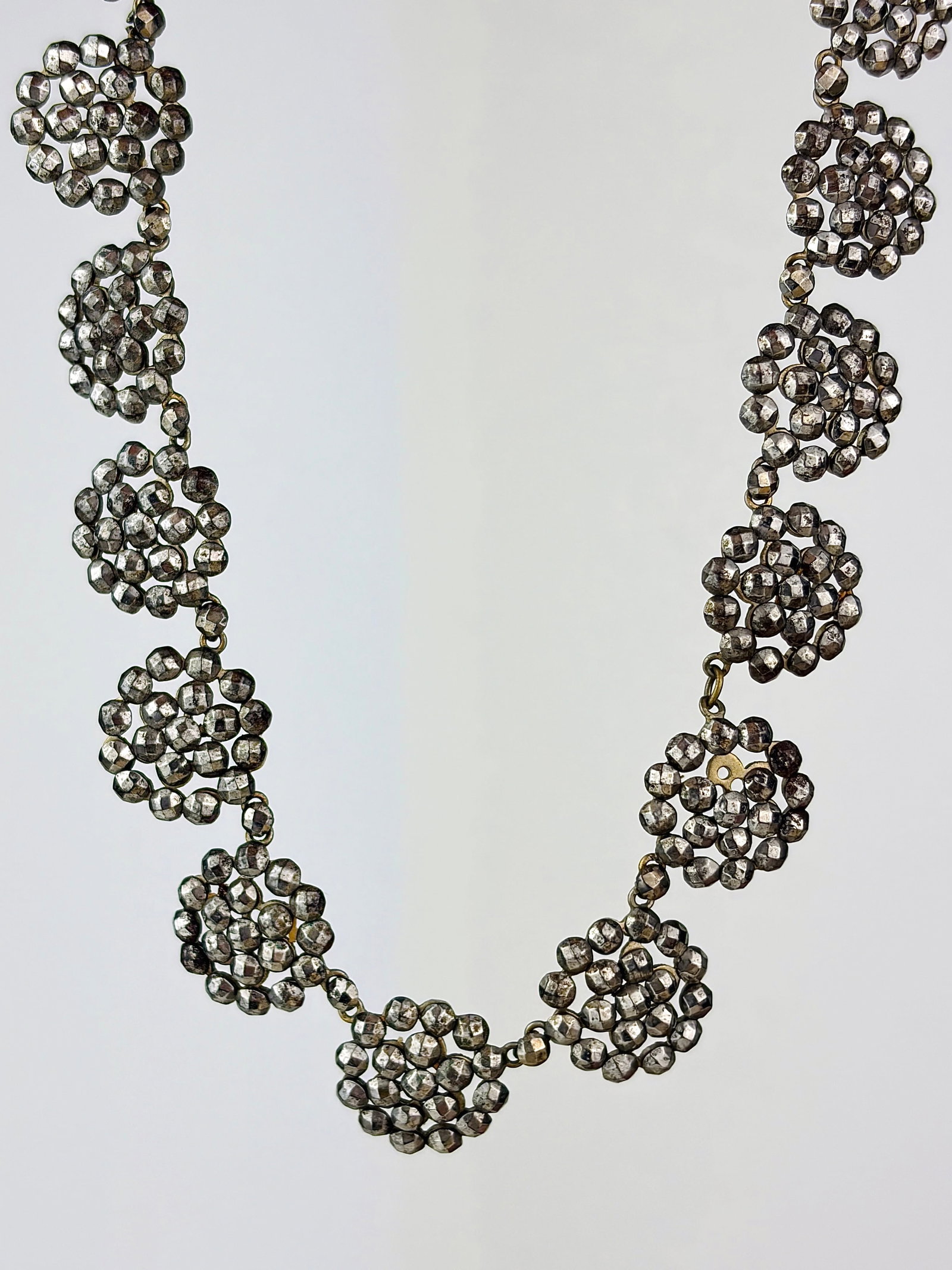 GEORGIAN ERA CUT STEEL RIVIERE NECKLACE: GEORGIAN ERA CUT STEEL RIVIERE NECKLACE Such a cool necklace from the Georgian era! Weight: 43.33g Size: Length 40cm, link width 15mm Materials: Cut steel Hallmarks: None present 